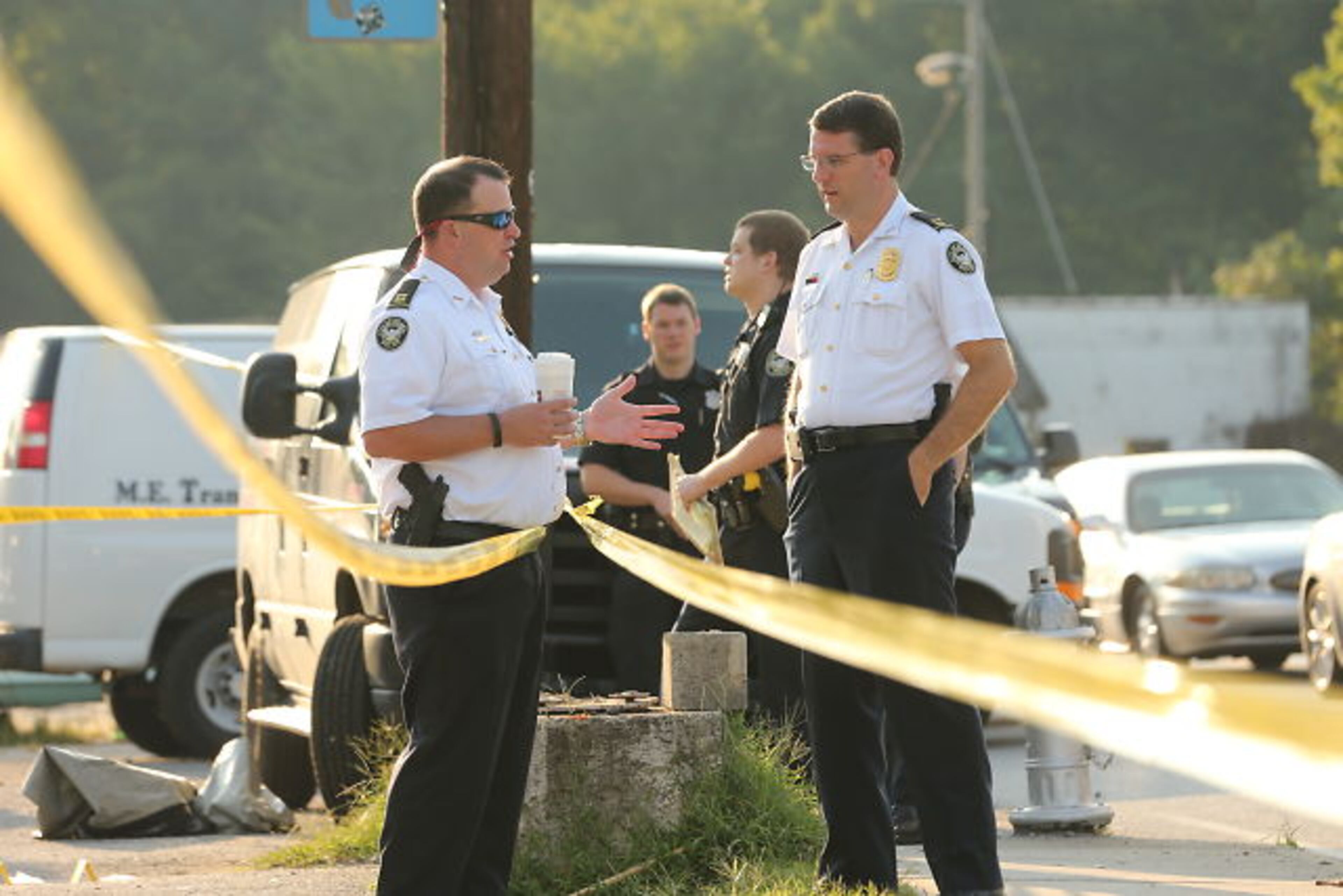 Atlanta homicide investigators were on the scene of fatal shooting in the 2500 block of Donald Lee Hollowell Parkway on Thurs., Aug. 27, 2015. JOHN SPINK / JSPINK@AJC.COM
