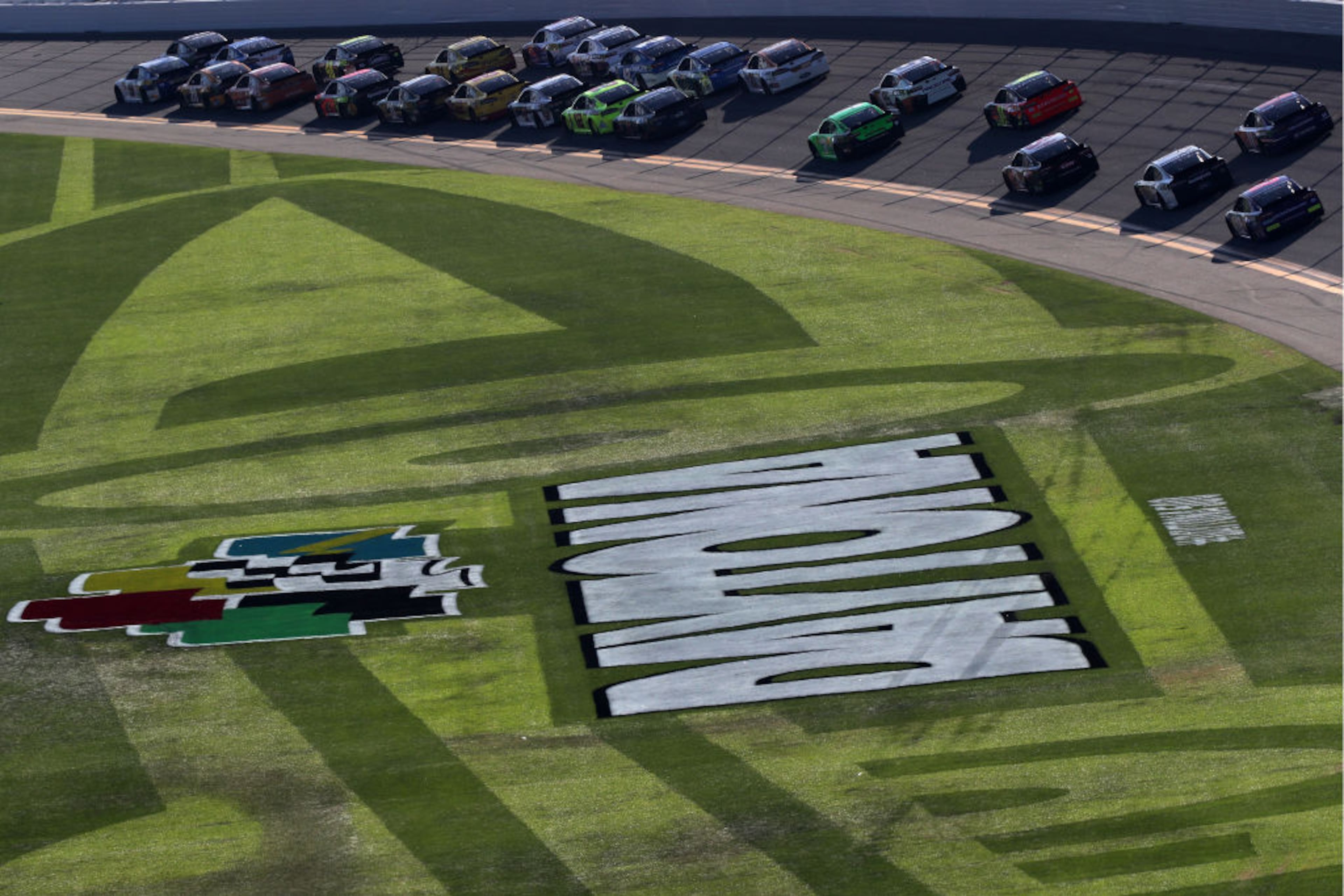 DAYTONA BEACH, FL - FEBRUARY 18: Cars race during the Monster Energy NASCAR Cup Series 60th Annual Daytona 500 at Daytona International Speedway on February 18, 2018 in Daytona Beach, Florida. (Photo by Sean Gardner/Getty Images)