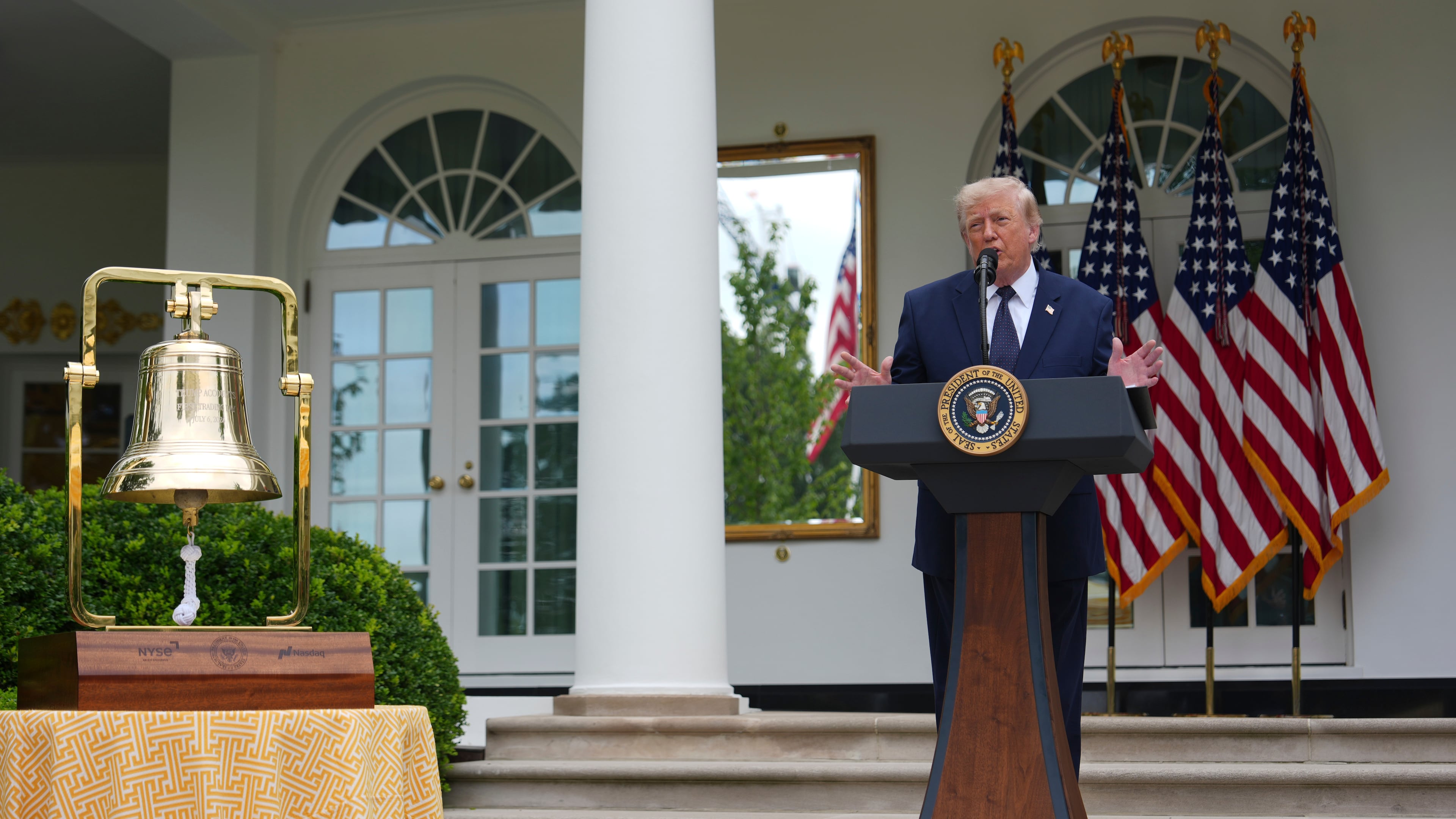 President Donald Trump speaks alongside the New York Stock Exchange bell at a lunch in the White House Rose Garden, Monday, July 6, 2026, in Washington. (AP Photo/Julia Demaree Nikhinson)