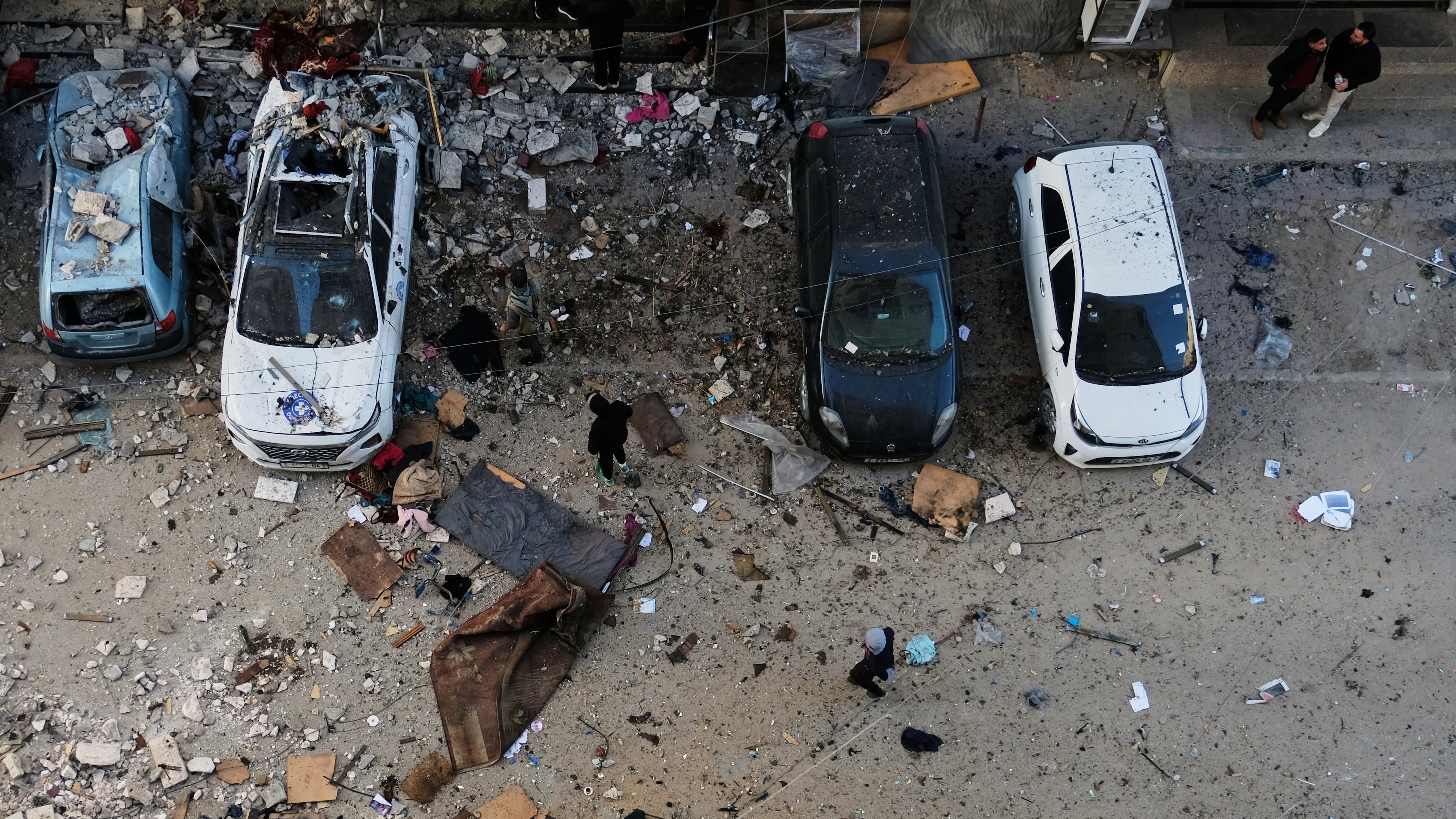Palestinians survey the damage to an apartment building after an Israeli military strike killed several people in Gaza City Saturday, Jan. 31, 2026. (AP Photo/Jehad Alshrafi)