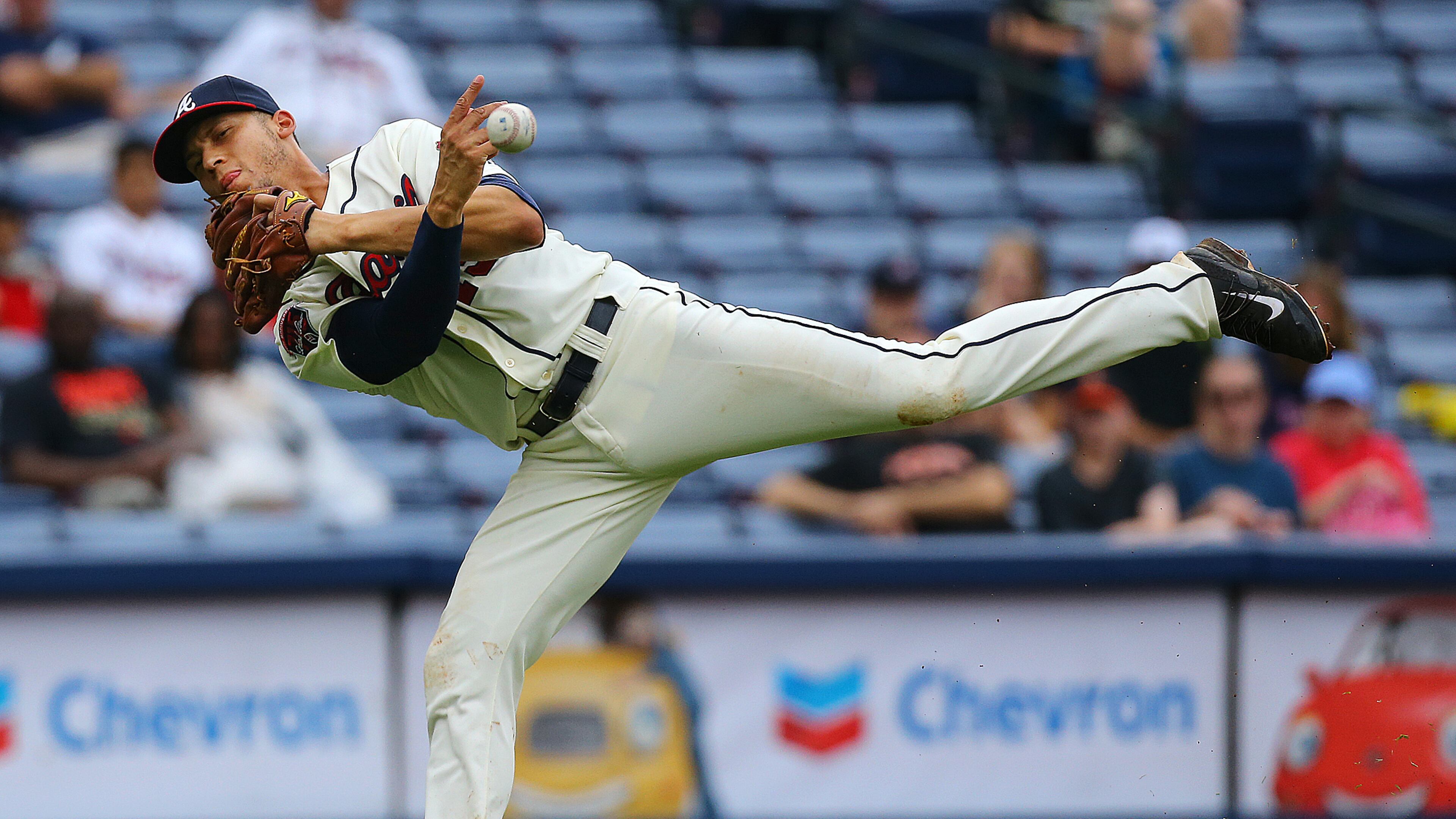 Braves' Andrelton Simmons makes a play on a ground ball hit by the Phillies' Marlon Byrd, throwing to first in 2014. CURTIS COMPTON / CCOMPTON@AJC.COM