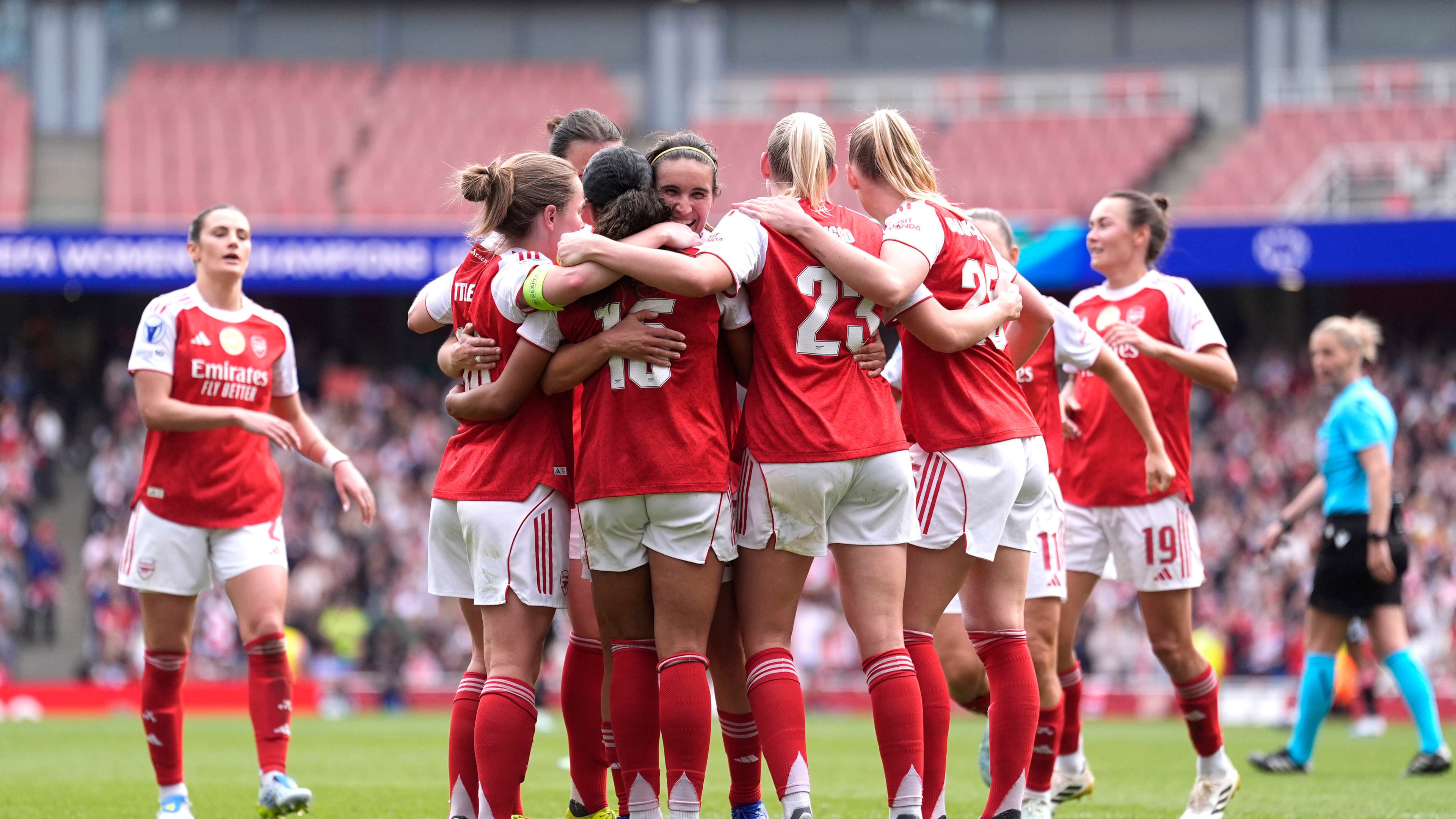 Arsenal's players celebrate their side's second goal scored by Olivia Smith during the Women's Champions League semi-final, first leg soccer match between Arsenal and OL Lyonnes in London, England, Sunday, April 26, 2026. (Andrew Matthews/PA via AP)