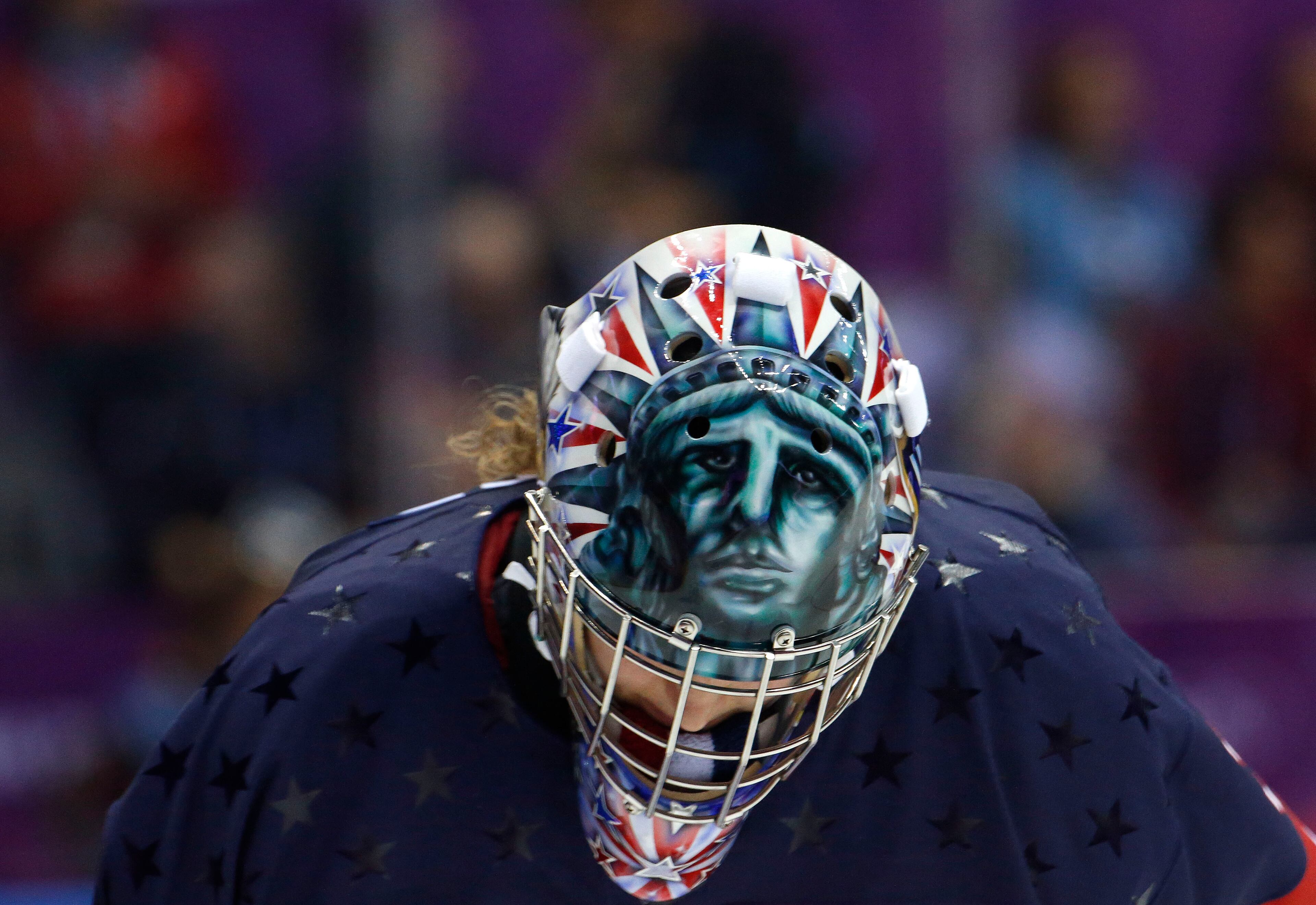 USA goalkeeper Jessie Vetter (31) looks down during a break in play during overtime of the women's gold medal ice hockey game against Canada at the 2014 Winter Olympics, Thursday, Feb. 20, 2014, in Sochi, Russia. (AP Photo/Mark Humphrey)