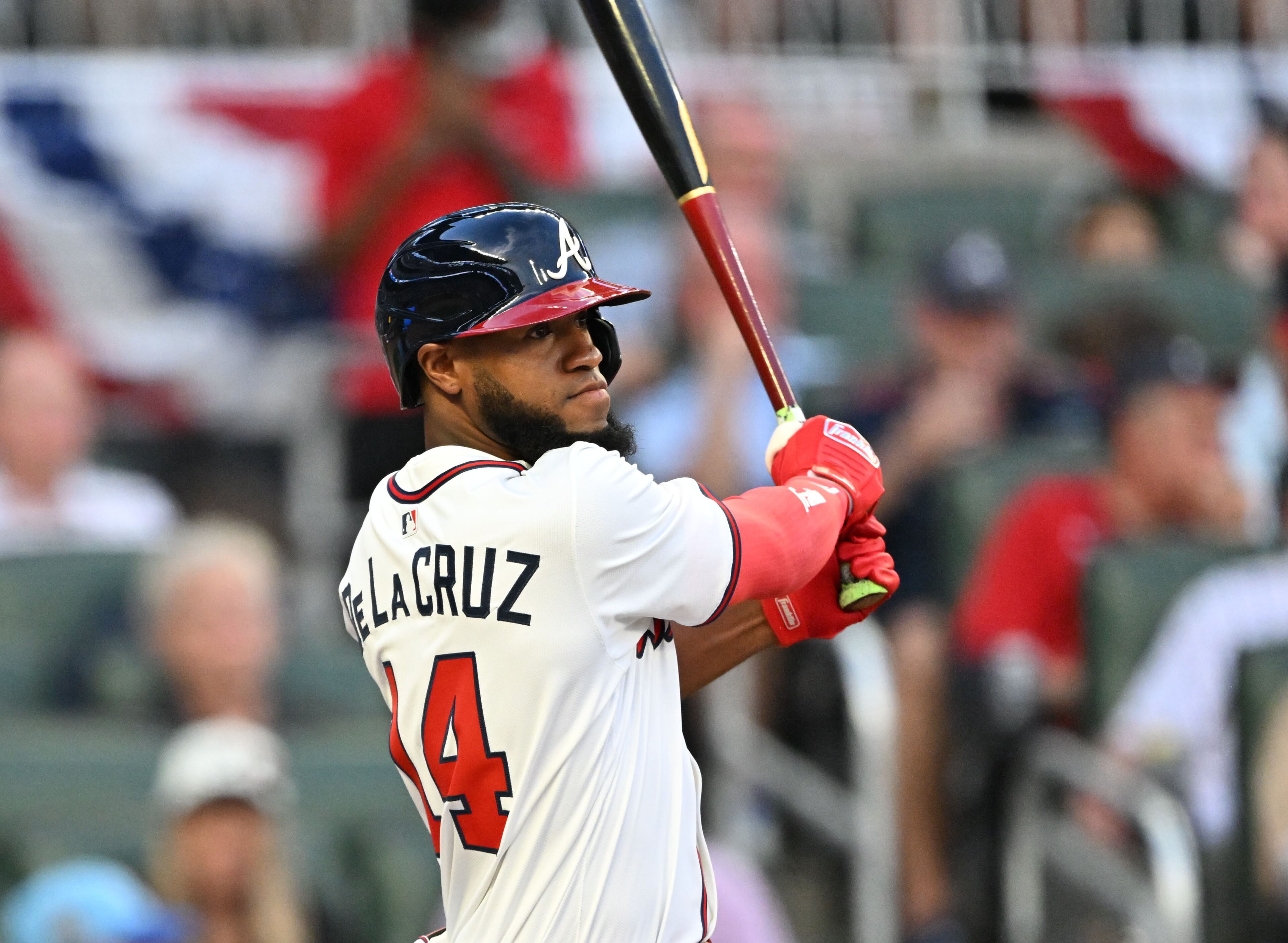 Atlanta Braves outfield Bryan De La Cruz (14) hits a single during the second inning of home opener baseball game at Truist Park, Friday, April 4, 2025, in Atlanta. (Hyosub Shin / AJC)