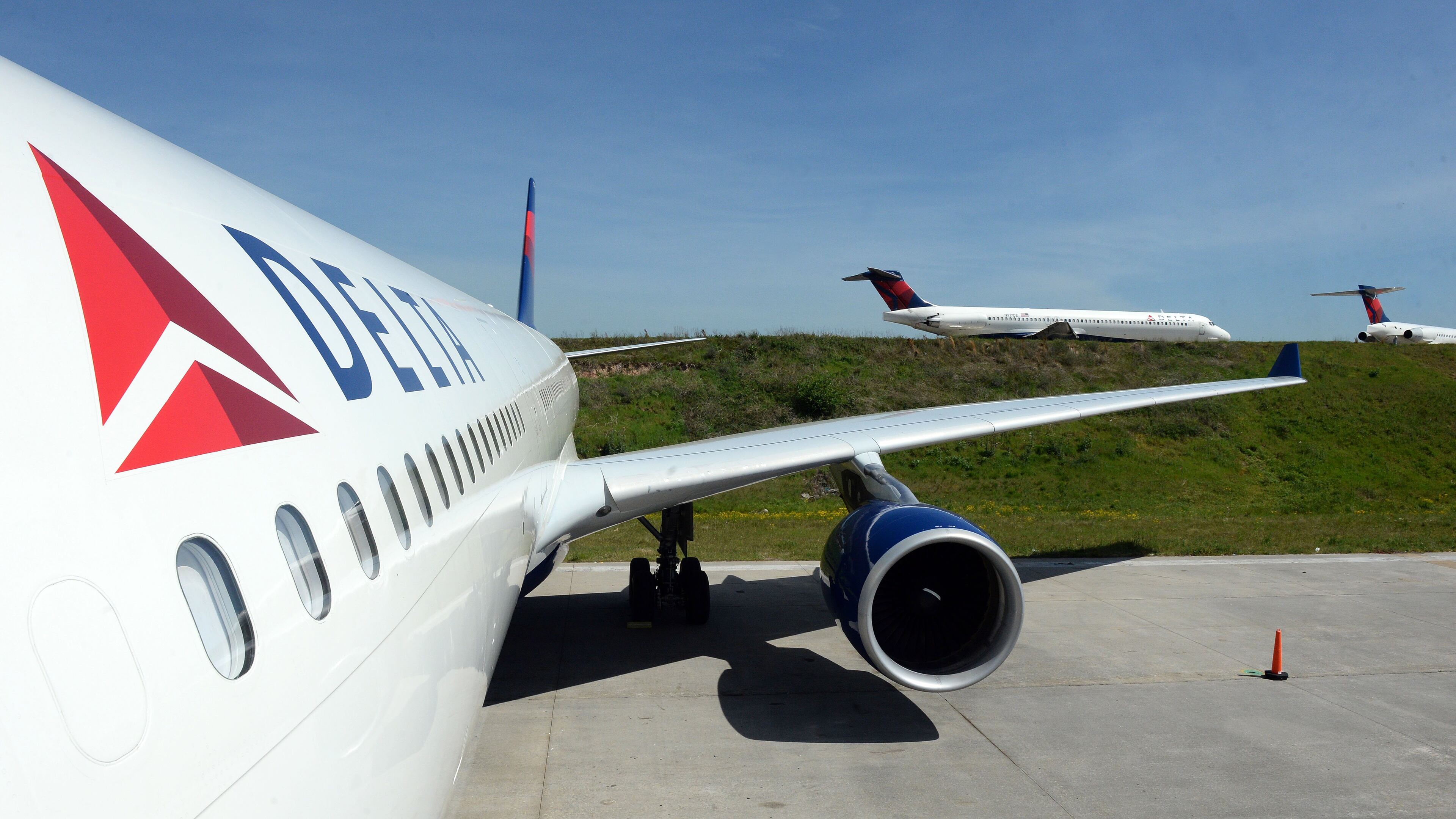 The exterior of the A330-300 is shown as aircraft taxi for take off in the background. KENT D. JOHNSON /kdjohnson@ajc.com