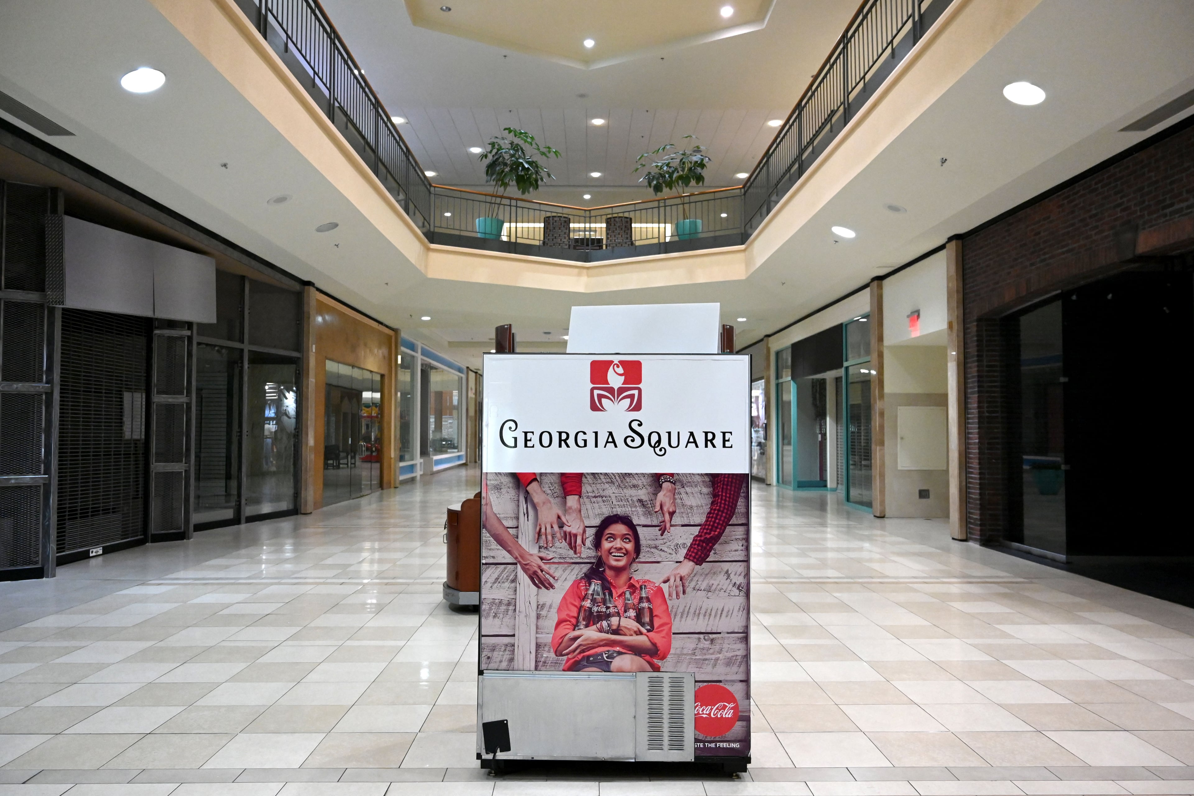 A "Georgia Square" sign sits in the middle of a nearly empty Georgia Square Mall in Athens in May 2025. (Hyosub Shin/AJC)