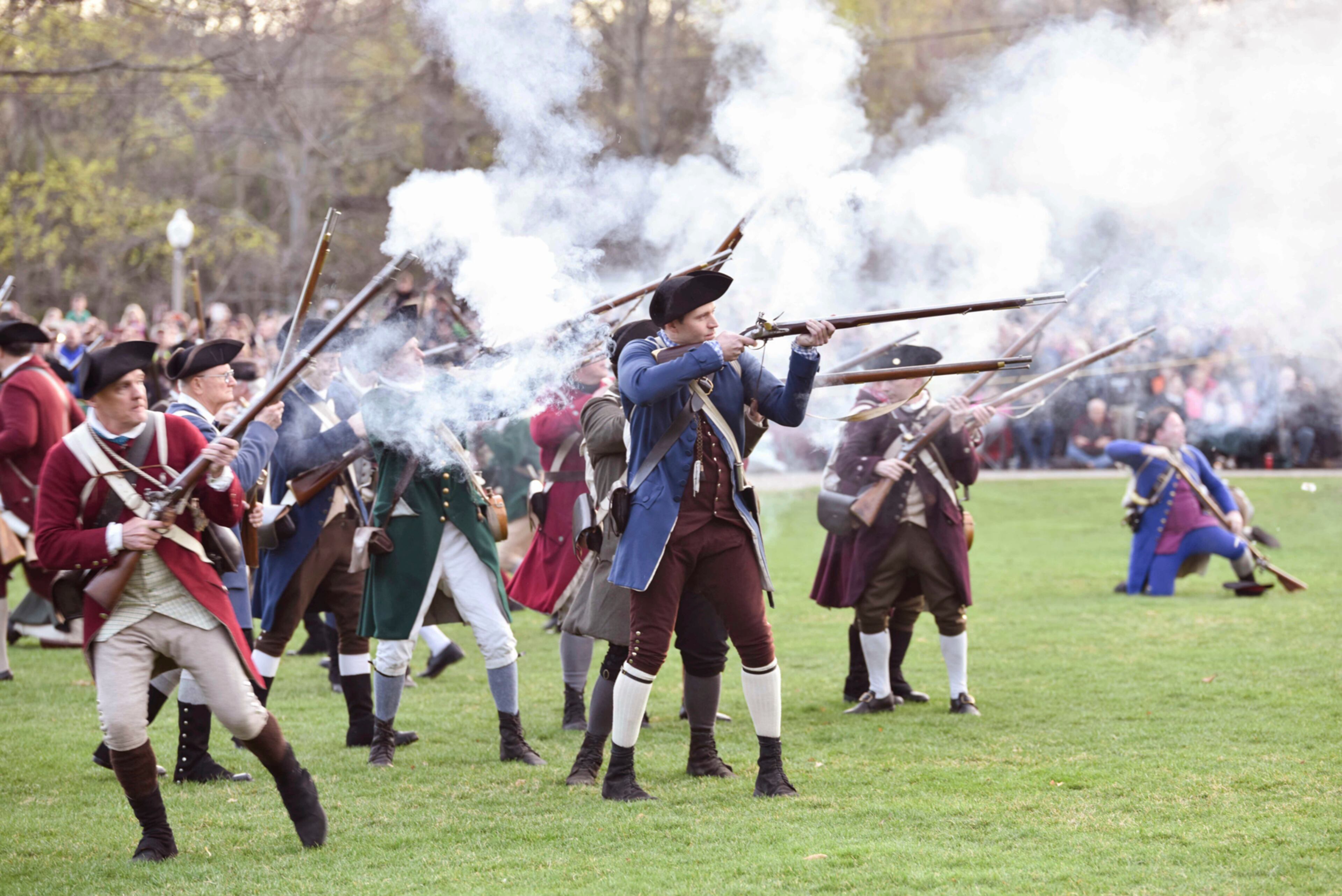 Colonial soldiers fire on the British during the Patriots' Day reenactment of the battles of Lexington and Concord, in Lexington, Mass. Monday, Aril 17, 2017. (Keith Viglione/The Boston Herald via AP)