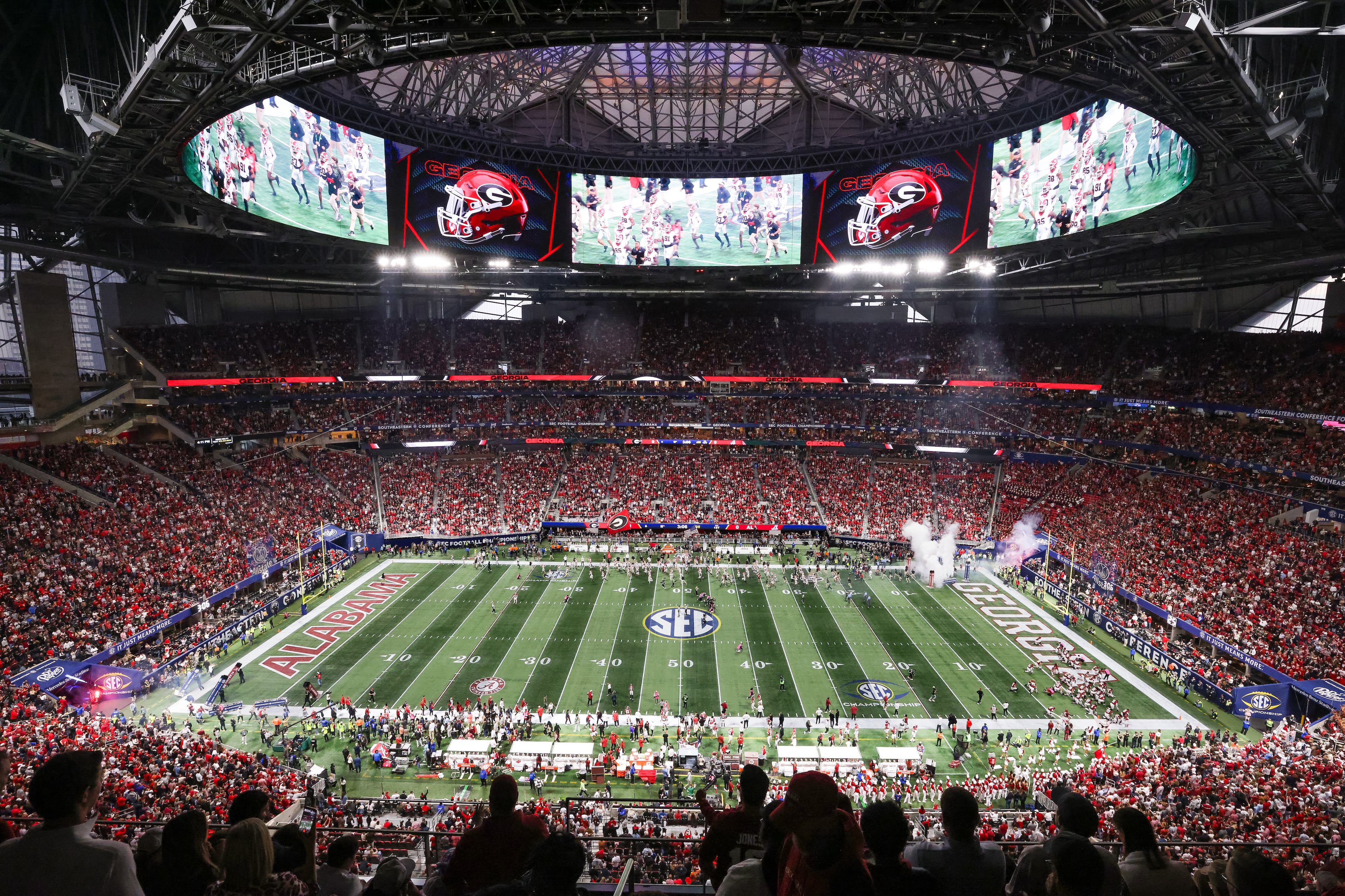 Georgia players enter the field to face Alabama in the SEC Championship Game at Mercedes-Benz Stadium, Saturday, Dec. 6, 2025, in Atlanta. (Jason Getz / AJC)