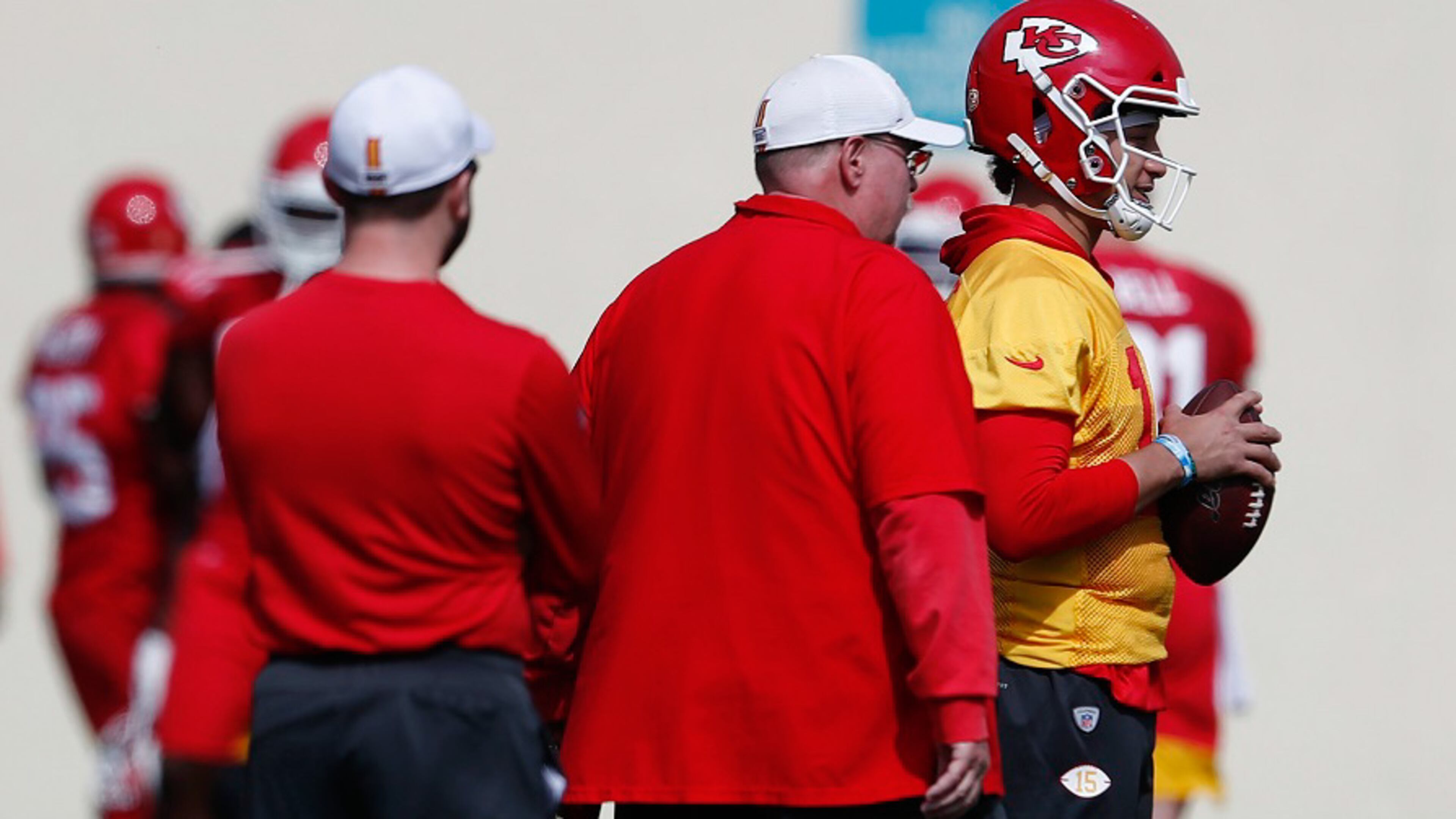 Kansas City Chiefs quarterback Patrick Mahomes (15) talks with coach Andy Reid during practice on Friday, Jan. 31, 2020, in Davie, Fla., for Super Bowl 54. (AP Photo/Brynn Anderson)
