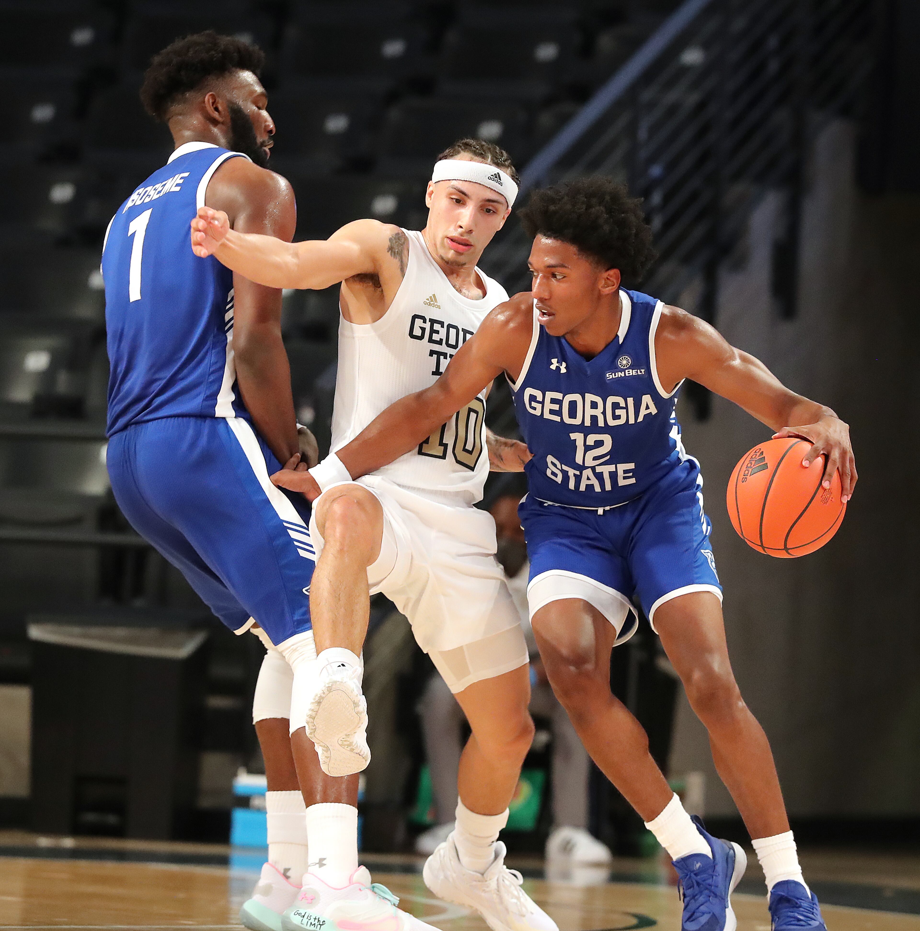 Georgia Tech guard Jose Alvarado (middle) defends against Georgia State guard Kane Williams while the Panthers' Eliel Nsoseme (far left) sets a screen. “Curtis Compton / Curtis.Compton@ajc.com”