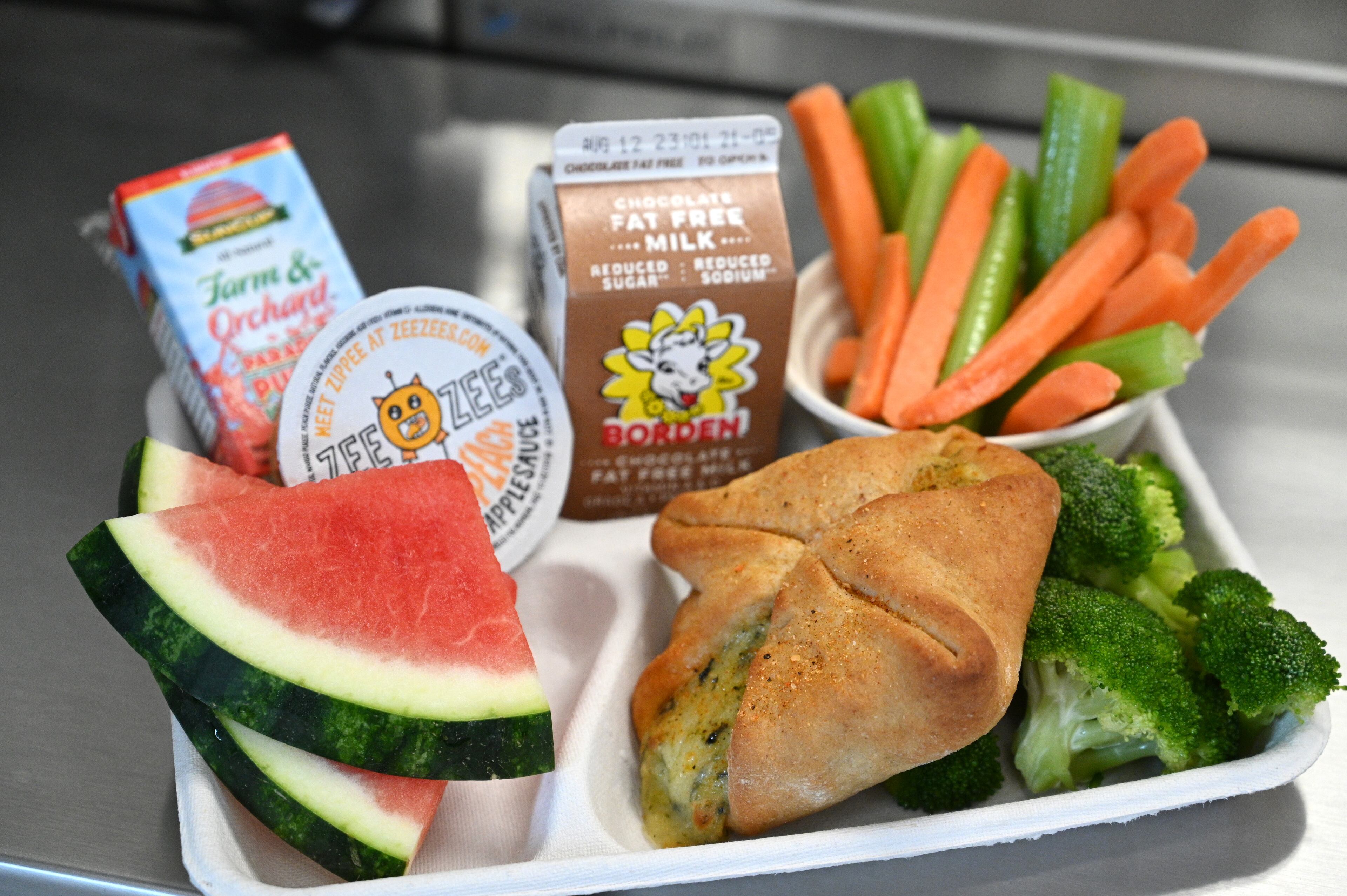 One new menu item in Gwinnett schools is a spinach and cheese pastry. Along with a main item, school lunches come with two fruit and two vegetable options. Georgia-grown watermelon will be a featured item throughout August. (Hyosub Shin / Hyosub.Shin@ajc.com)