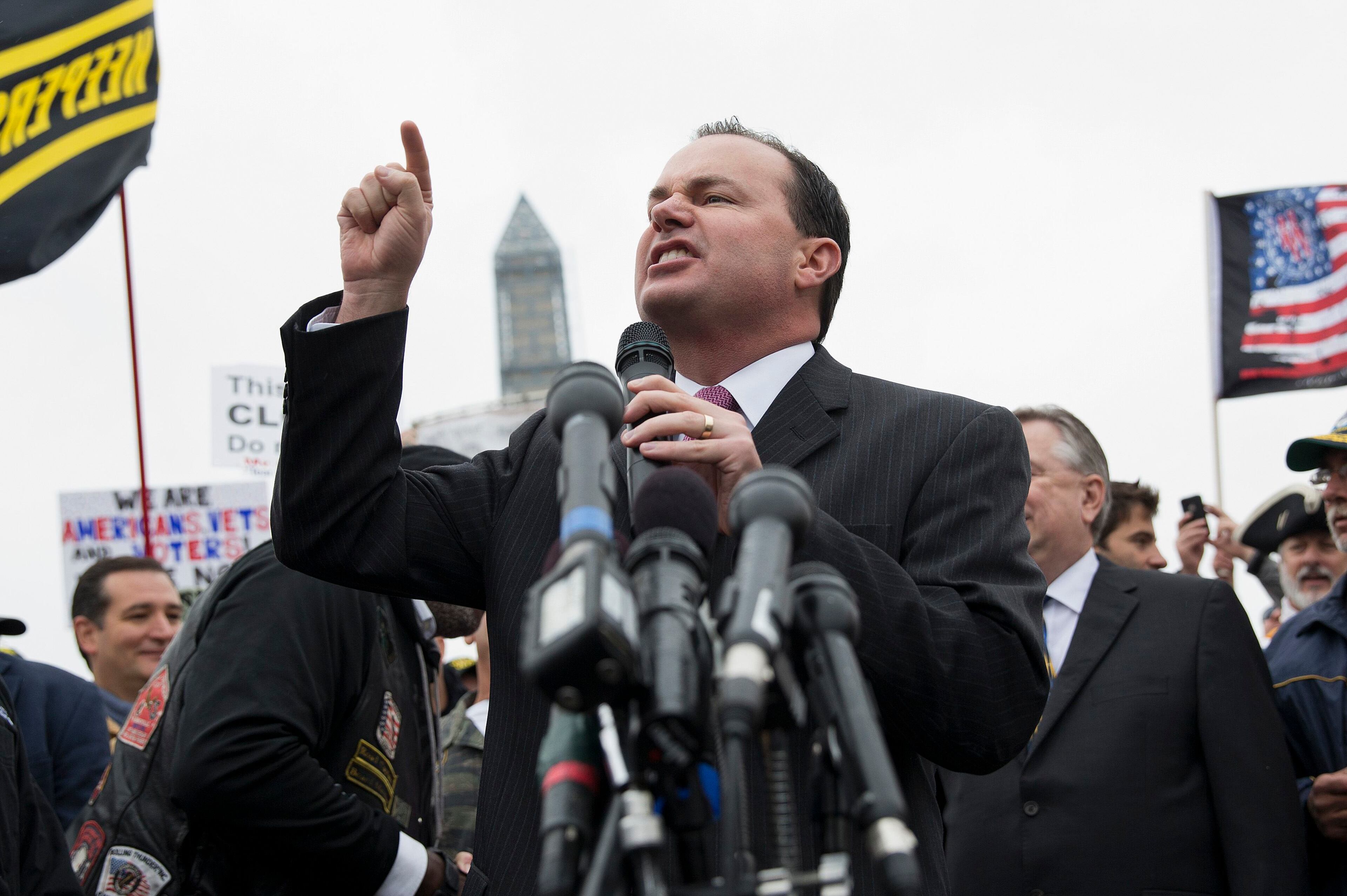 Senator Mike Lee (R-UT) speaks at the "Million Vet March on the Memorials" at the U.S. National World War II Memorial in Washington October 13, 2013. The group was organized in protest of the Obama administration's decision to close the memorial and bar entry to World War Two vets who had traveled to visit it during the partial government shut down. REUTERS/Joshua Roberts