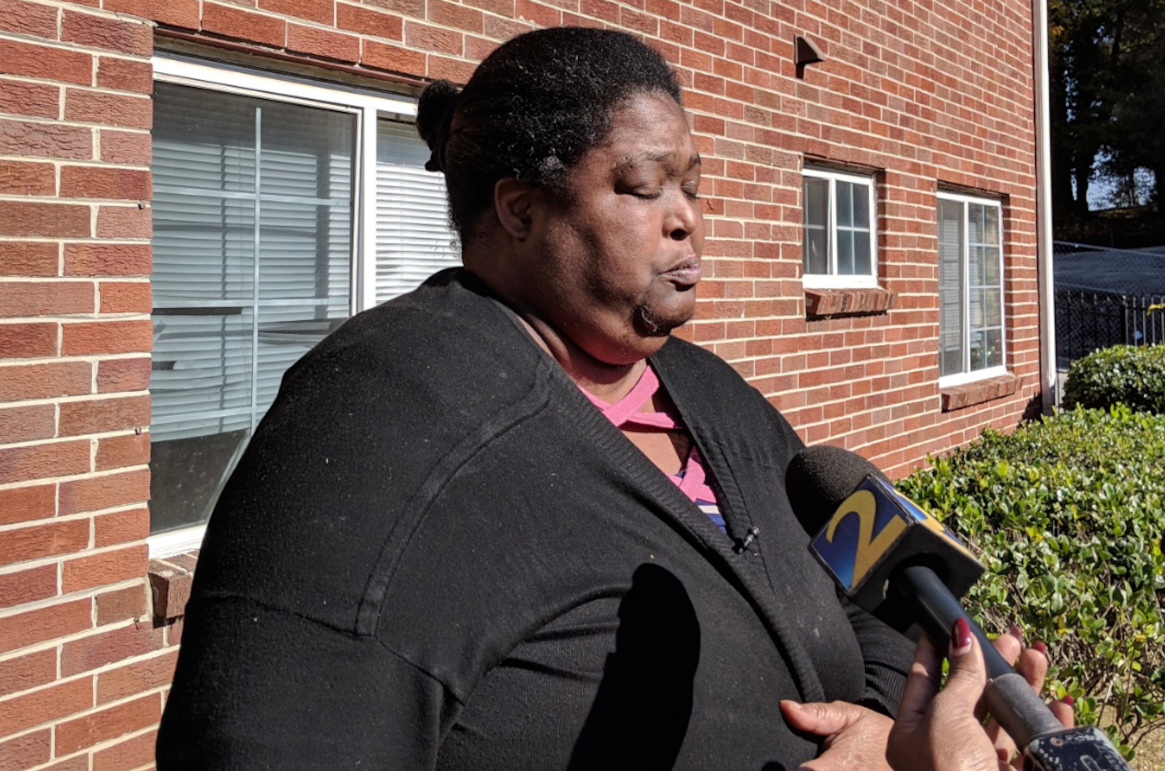 Sonja Denise Harrison said whoever shot and killed her 14-year-old daughter also took her unborn grandchild's life. She spoke to reporters Tuesday outside the apartment where the teenager died.