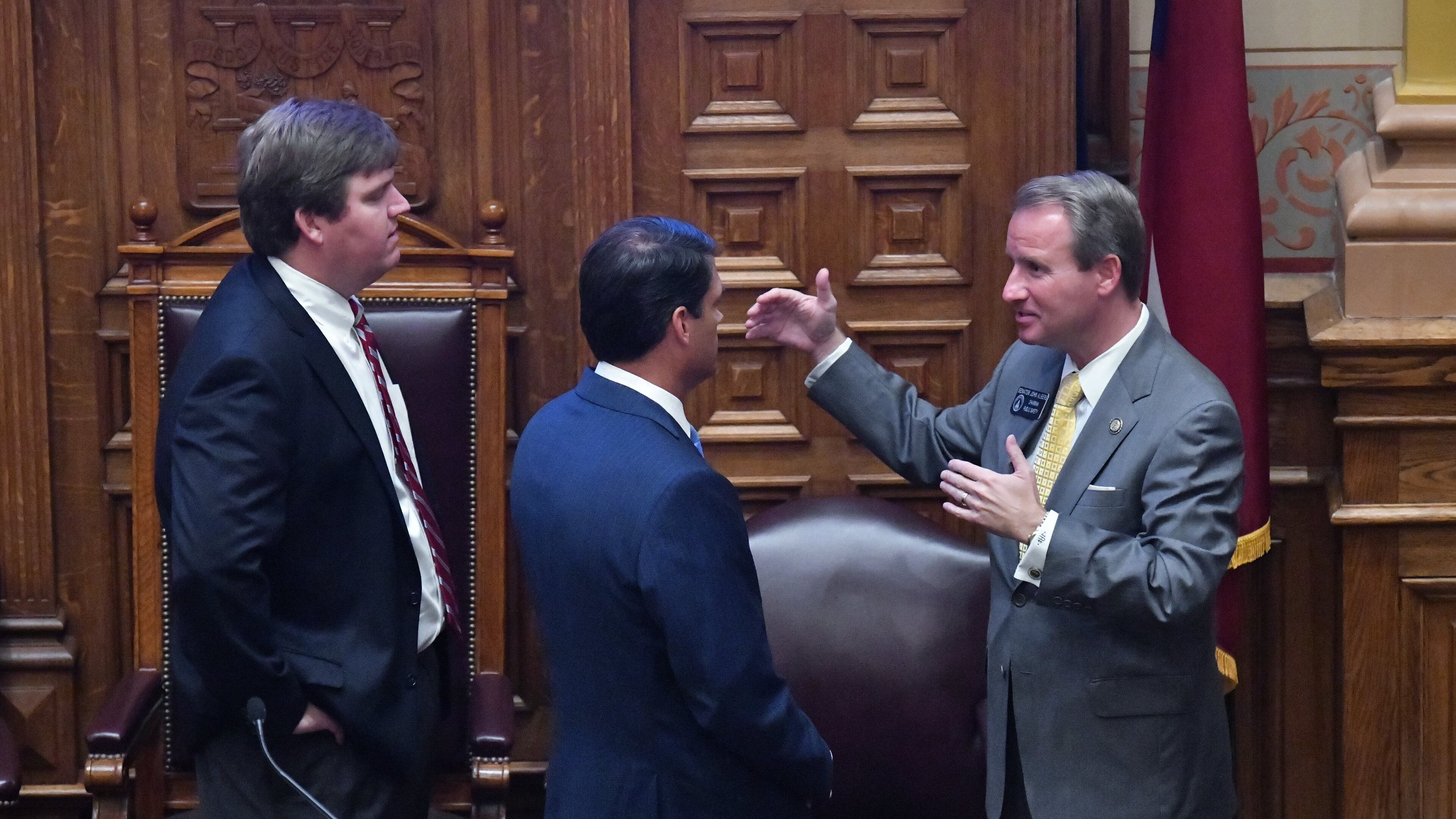 June 23, 2020 Atlanta - From left, Chief of Staff for Lt. Governor Duncan, John Porter, Lieutenant Governor Geoff Duncan and Sen. John Albers (R-Roswell) confer in the Senate Chambers on day 37 of the legislative session at Georgia State Capitol on Tuesday, June 23, 2020. (Hyosub Shin / Hyosub.Shin@ajc.com)