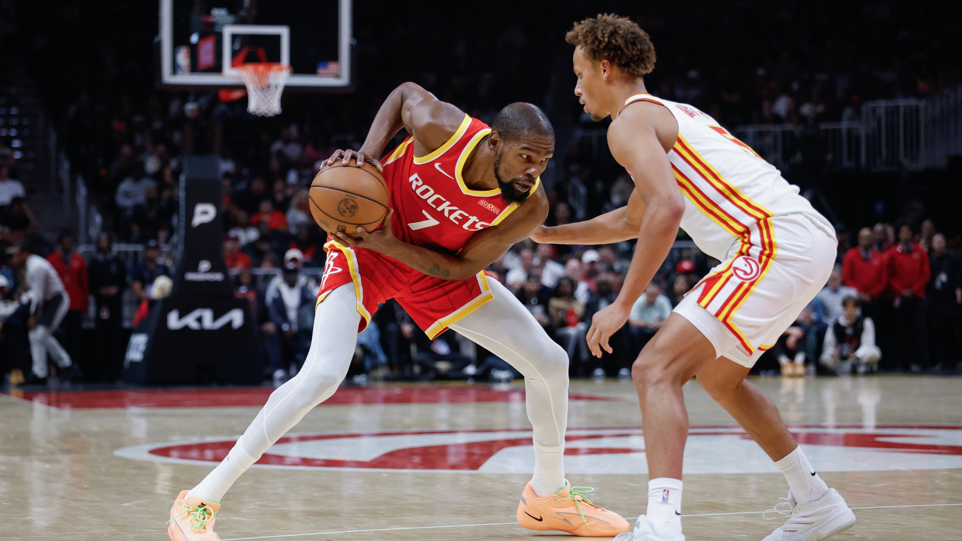 Houston Rockets forward Kevin Durant (7) drives against Atlanta Hawks guard Dyson Daniels, right, during the first half of an NBA basketball game, Saturday, Oct. 24, 2026, in Atlanta. (AP Photo/Erik S. Lesser)
