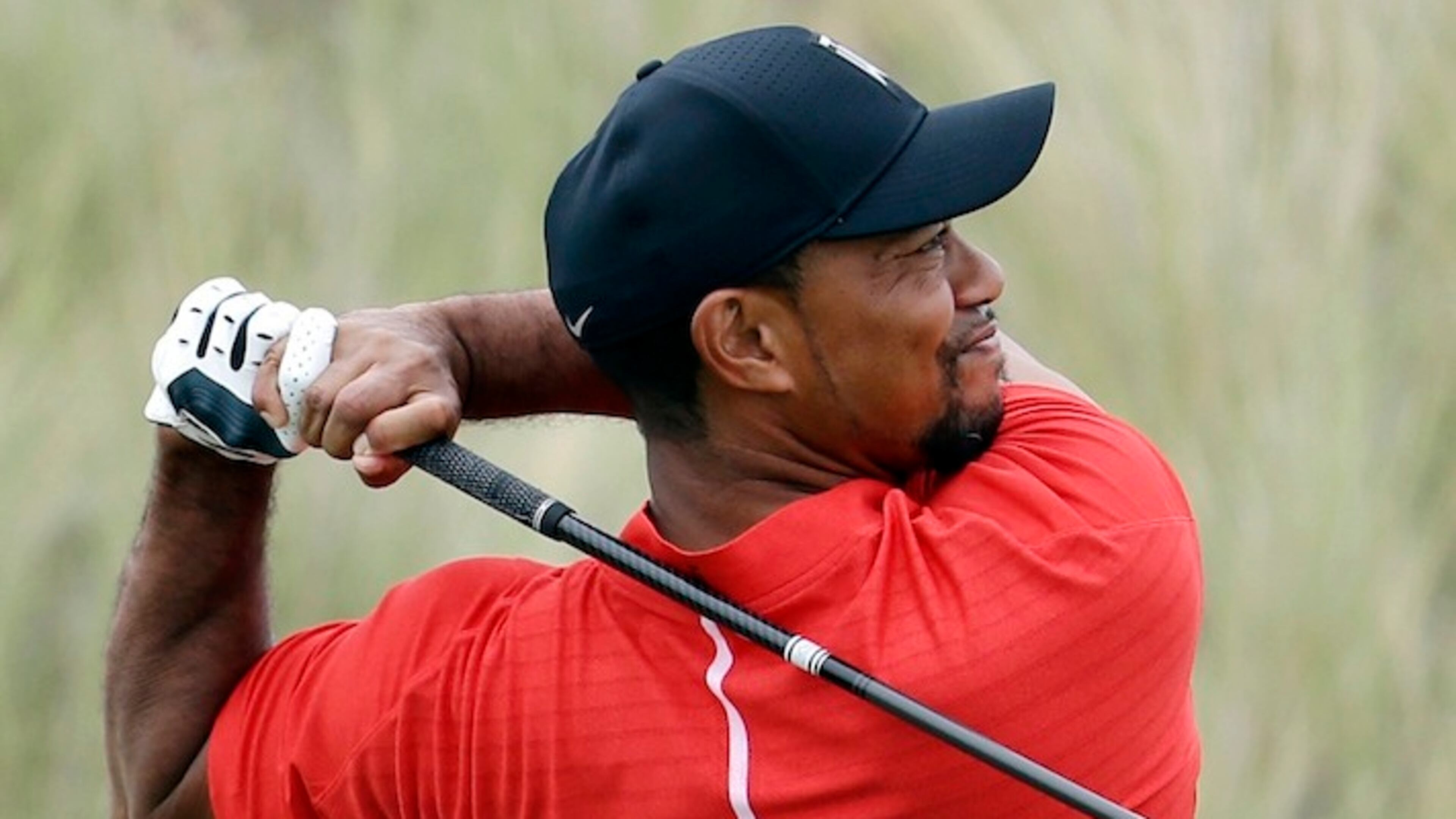 Tiger Woods watches his tee shot from the third hole during the final round at the Hero World Challenge golf tournament, Sunday, Dec. 4, 2016, in Nassau, Bahamas. (AP Photo/Lynne Sladky)