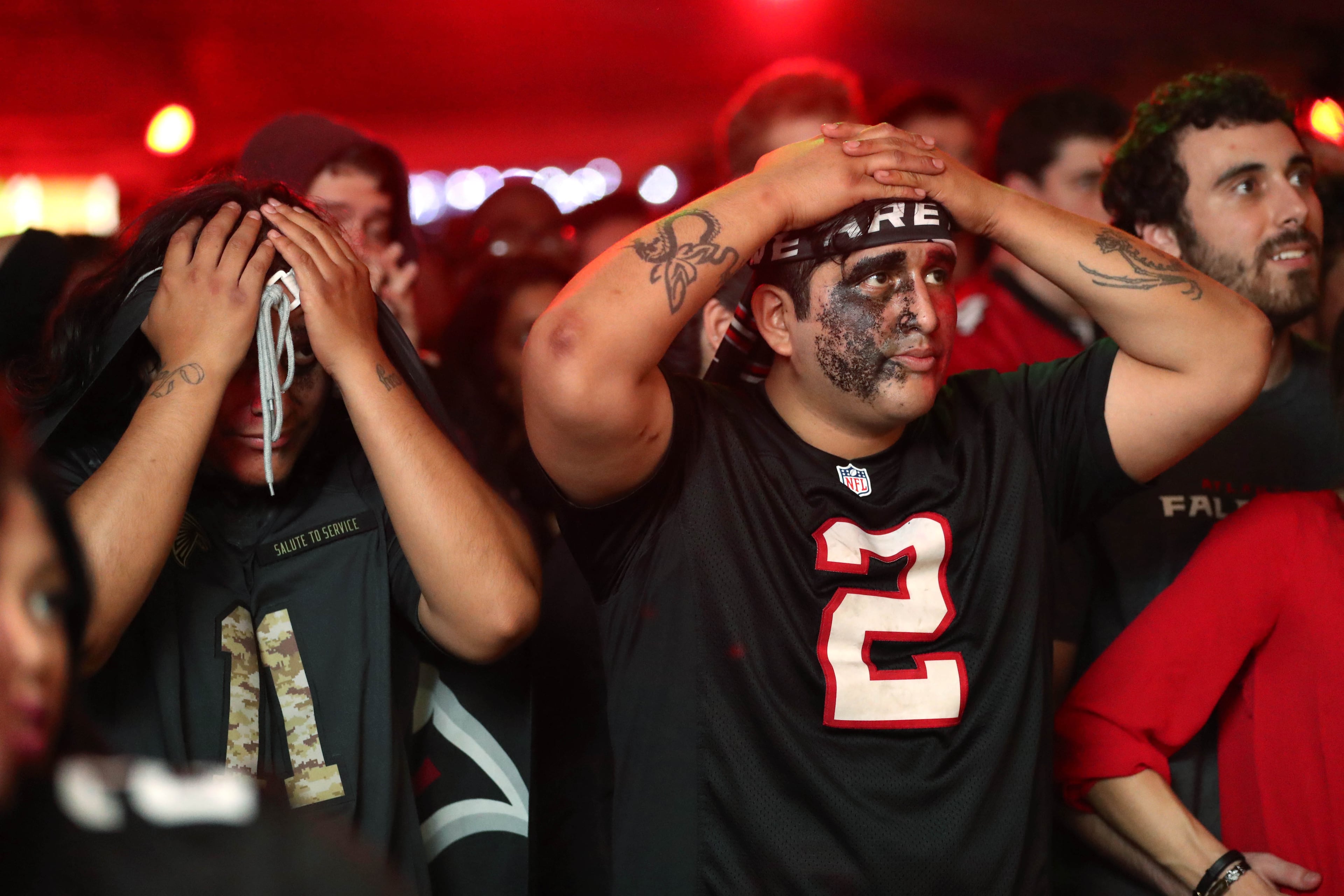 February 5, 2017 - Atlanta, Ga: Atlanta Falcons fans Jason Solis, left (11 jersey), and John Vergalejo (2) react to a play in the fourth quarter of Super Bowl 51 at Park Tavern Sunday February 5, 2017, in Atlanta. The Falcons lost to the Patriots 34-28 in overtime. PHOTO / JASON GETZ