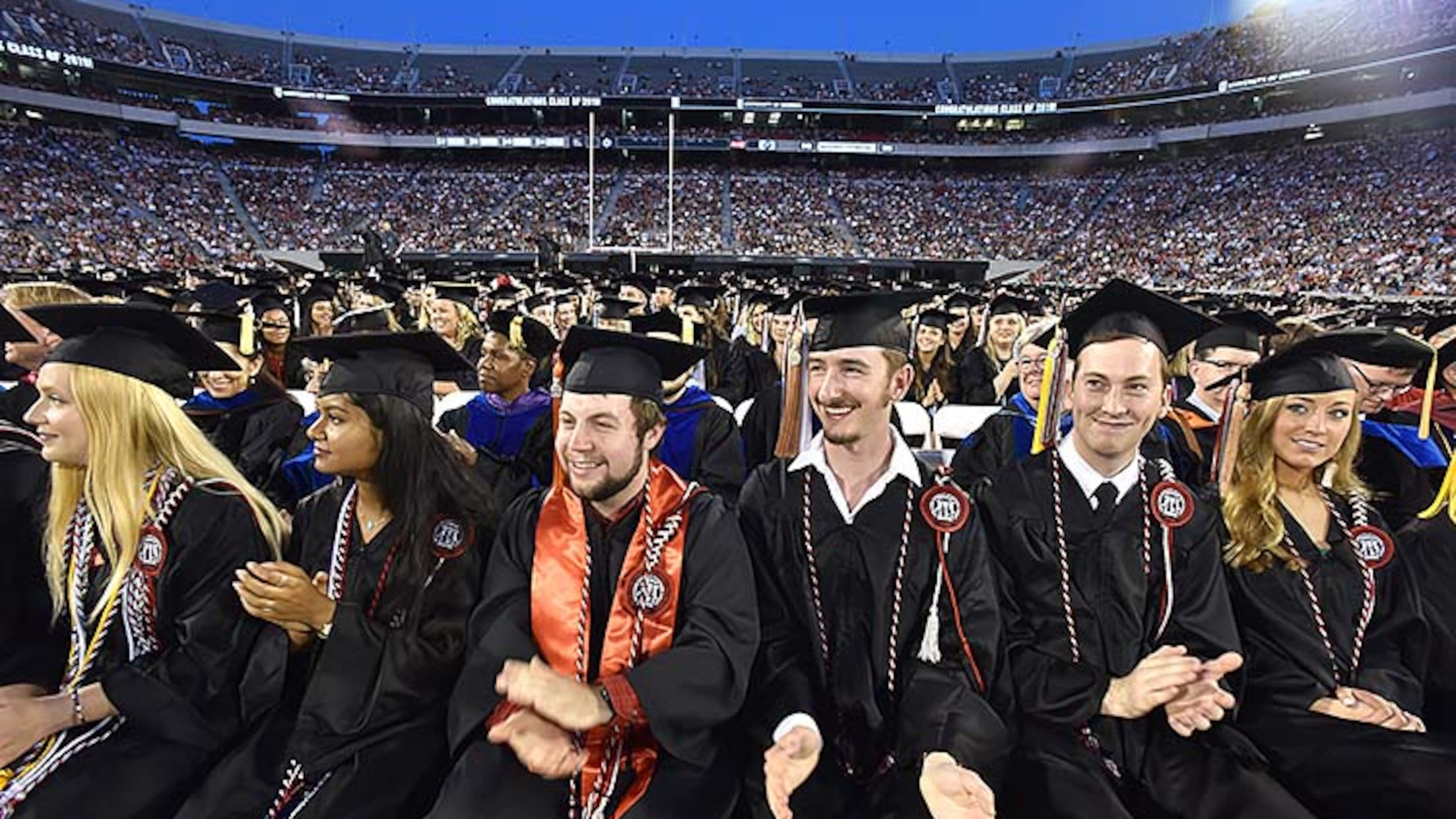 May 10, 2019 Athens - Students react as they listen to commencement speaker Deborah Ann Roberts, news correspondent, during UGA's 2019 spring undergraduate commencement ceremony at Sanford Stadium in Athens on Friday, May 10, 2019. HYOSUB SHIN / HSHIN@AJC.COM
