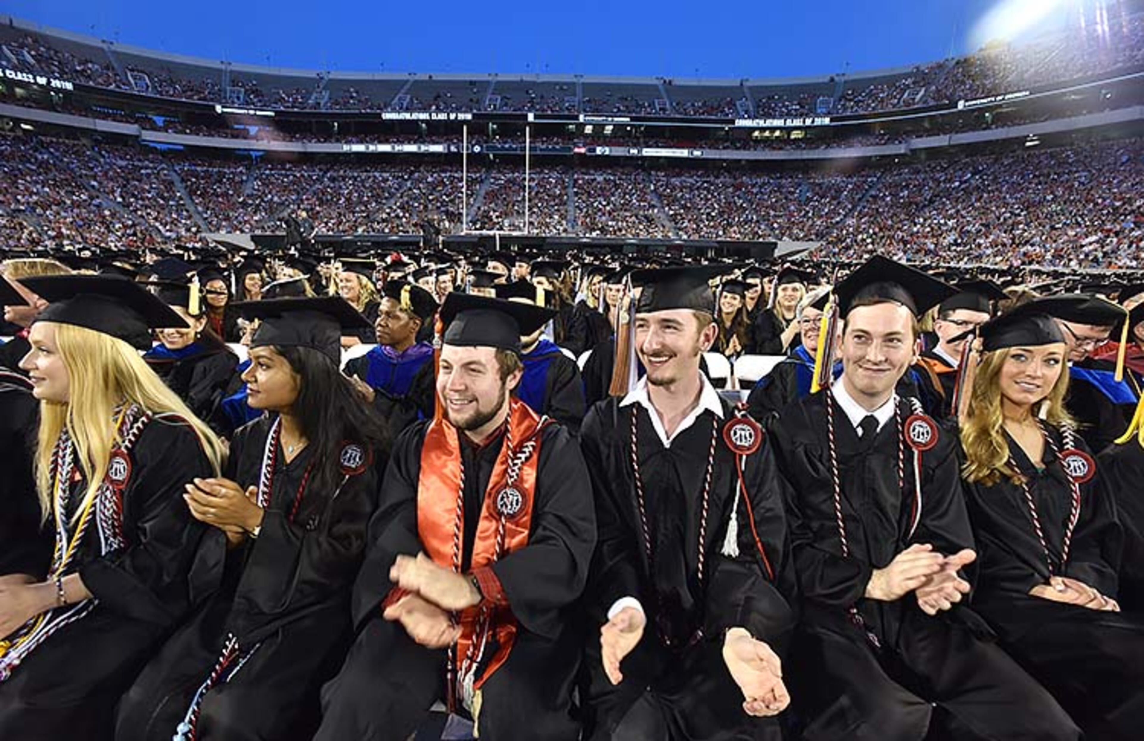 May 10, 2019 Athens - Students react as they listen to commencement speaker Deborah Ann Roberts, news correspondent, during UGA's 2019 spring undergraduate commencement ceremony at Sanford Stadium in Athens on Friday, May 10, 2019. HYOSUB SHIN / HSHIN@AJC.COM