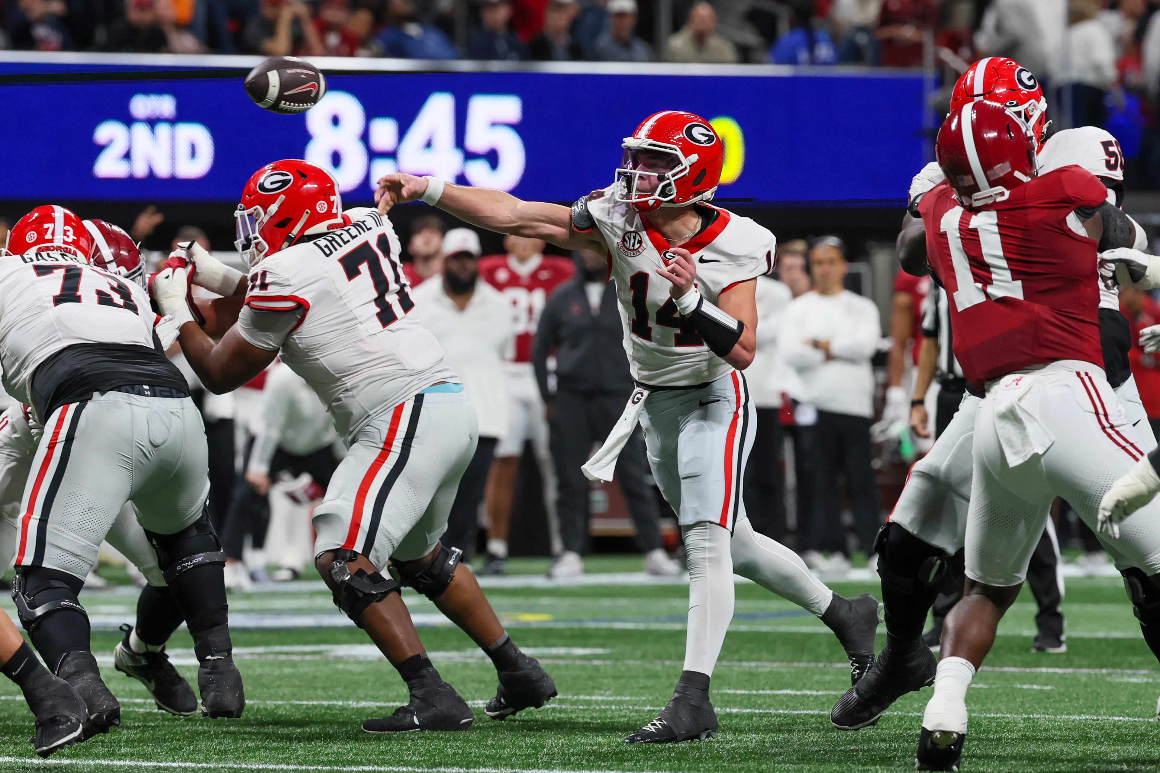 Georgia quarterback Gunner Stockton (14) throws a touchdown pass to wide receiver Dillon Bell (86) during the second quarter of the SEC Championship game at Mercedes-Benz Stadium, Saturday, Dec. 6, 2025, in Atlanta. (Jason Getz / AJC)
