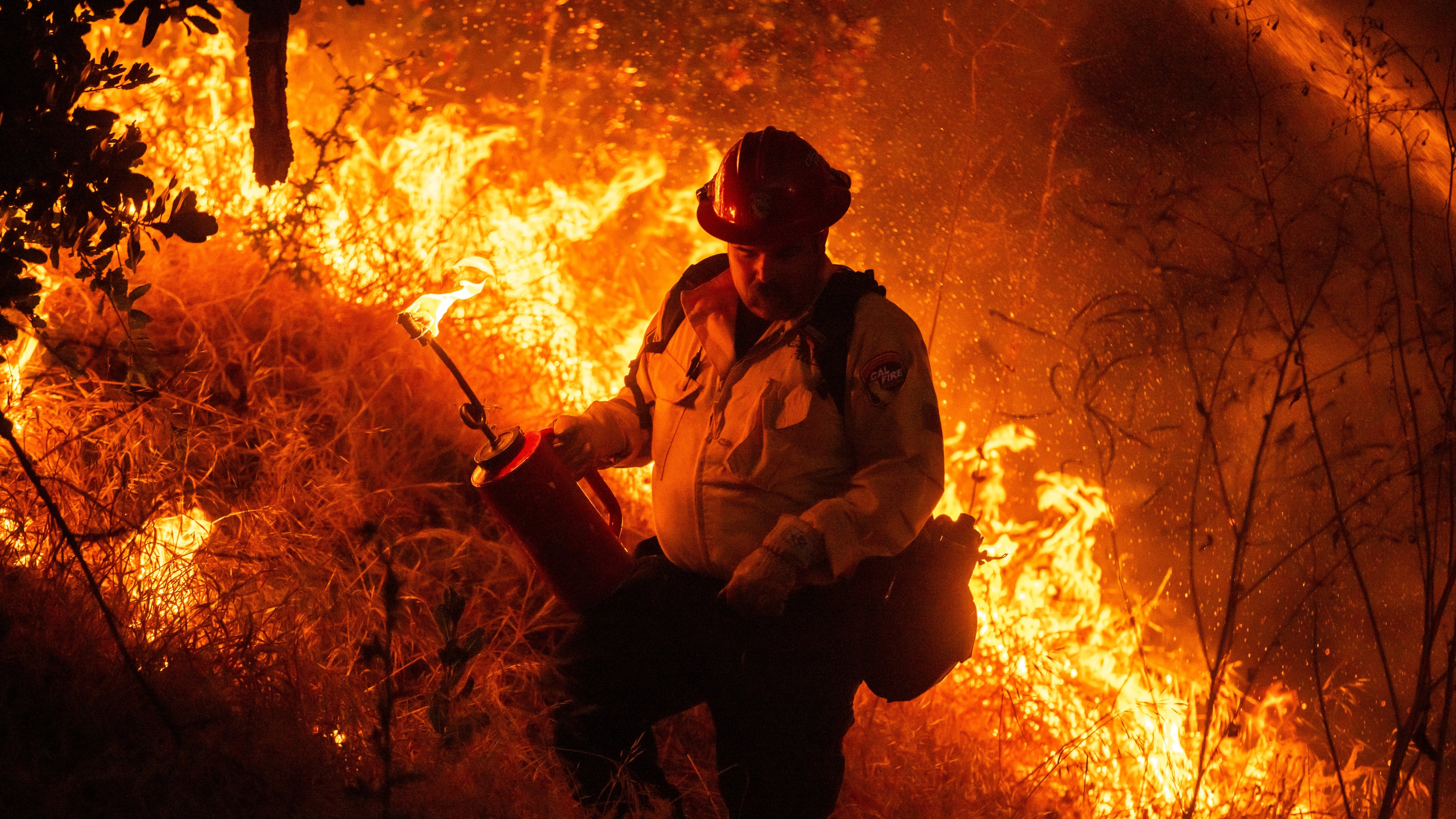 Fire crews conduct a firing operation to control the Sandy Fire Monday, May 18, 2026, in Simi Valley, Calif. (AP Photo/Ethan Swope)