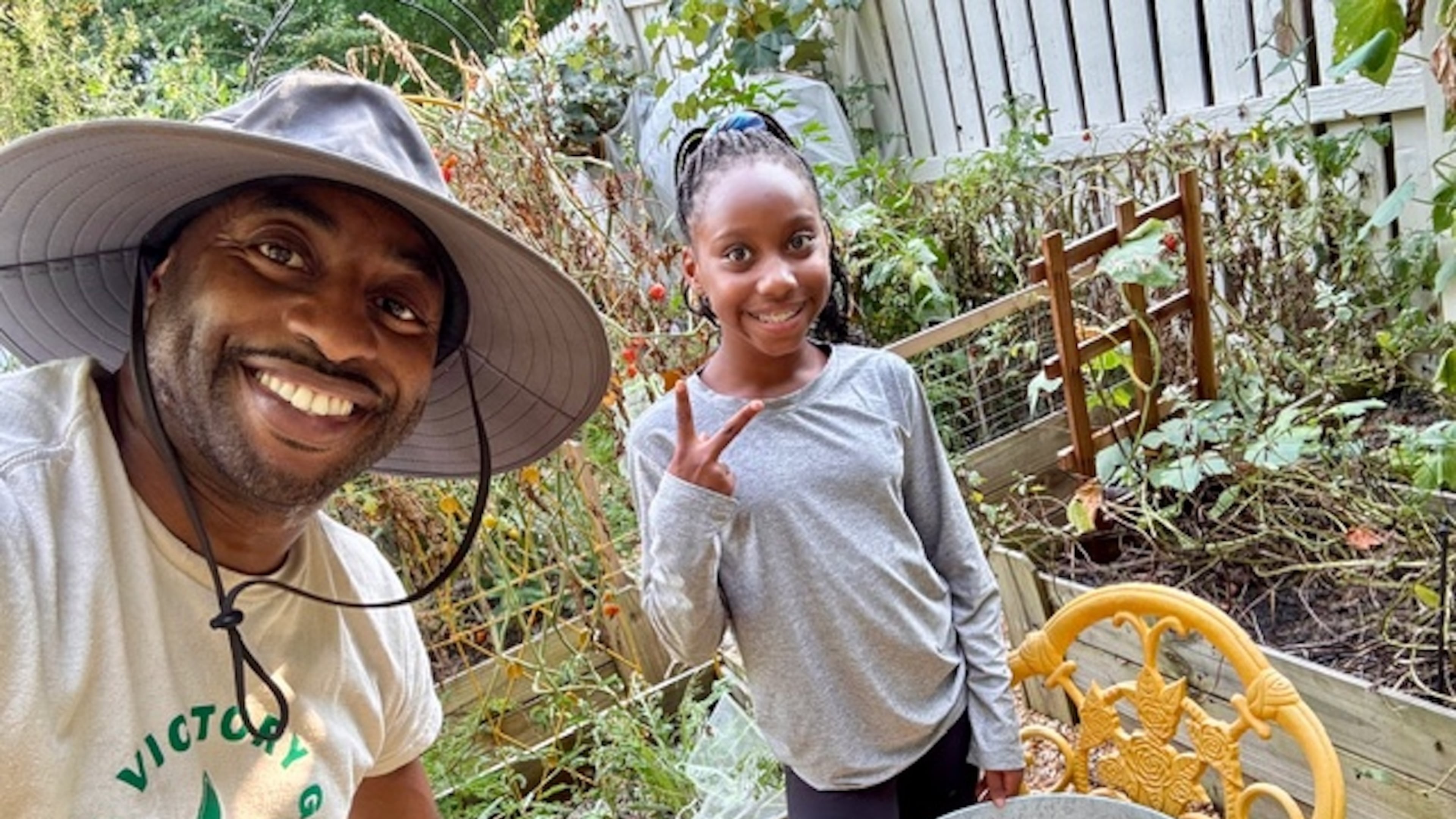Michael McKeavin of Georgia Victory Gardens and his youngest daughter, Lauren, work in their Roswell garden. (Courtesy of Michael McKeavin)