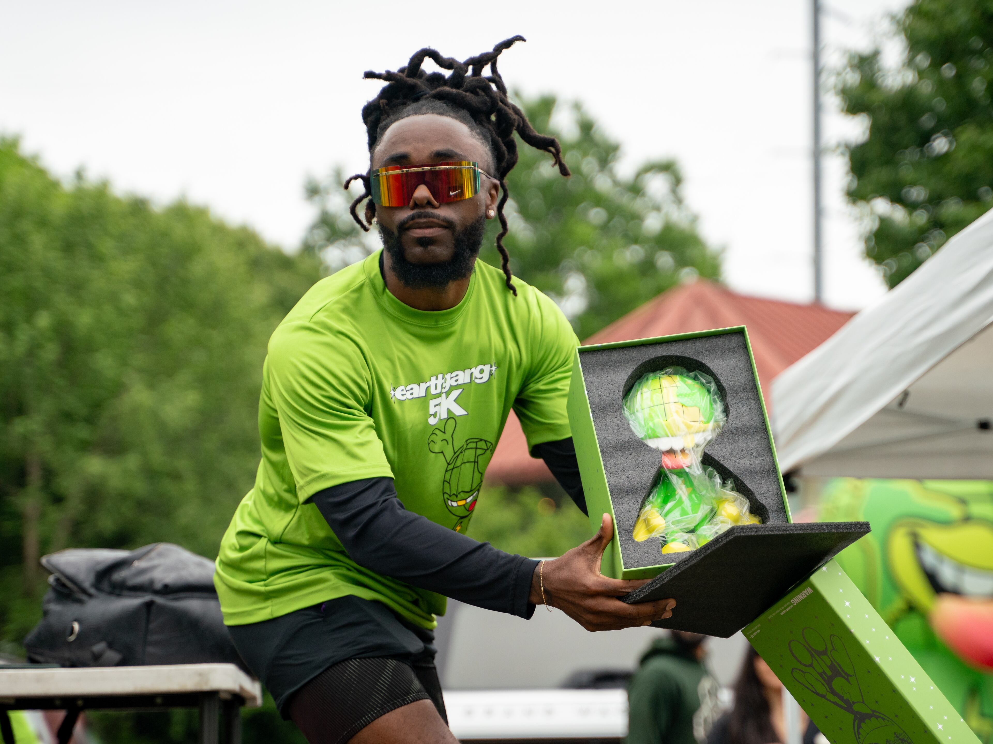 Olu of Atlanta-based rap group Earthgang prepares to participate in the first annual Earthgang 5k run in Atlanta on Saturday, April 27, 2024. (Ben Hendren for The Atlanta Journal-Constitution)