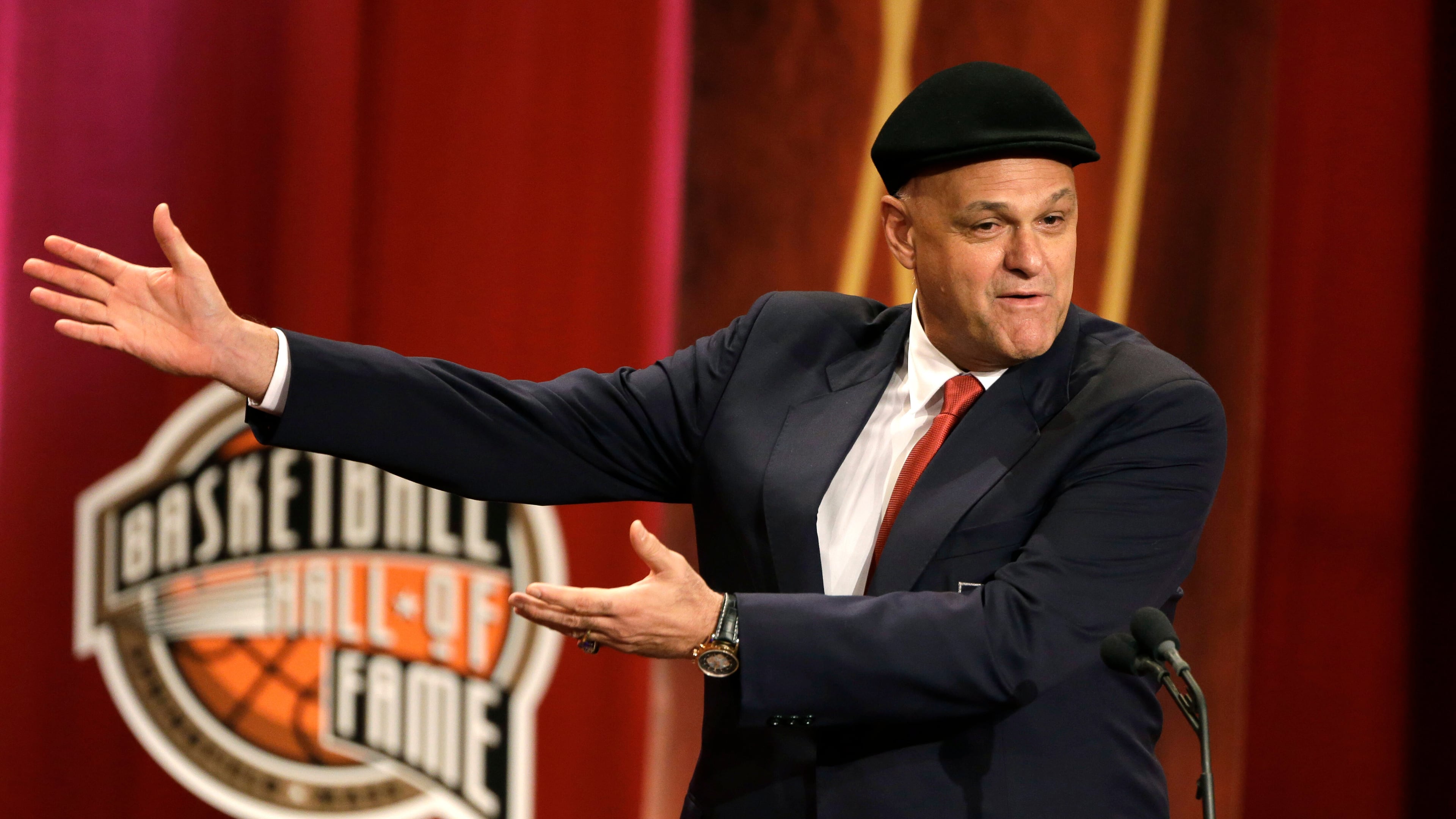 FILE - Inductee Oscar Schmidt, of Brazil, speaks during the enshrinement ceremony for this year's class of the Basketball Hall of Fame, at Symphony Hall in Springfield, Mass., Sept. 8, 2013. Schmidt, whom his Brazil compatriots know as the “Holy Hand,” died. Friday, April 17, 2026. He was 68. (AP Photo/Steven Senne, File)