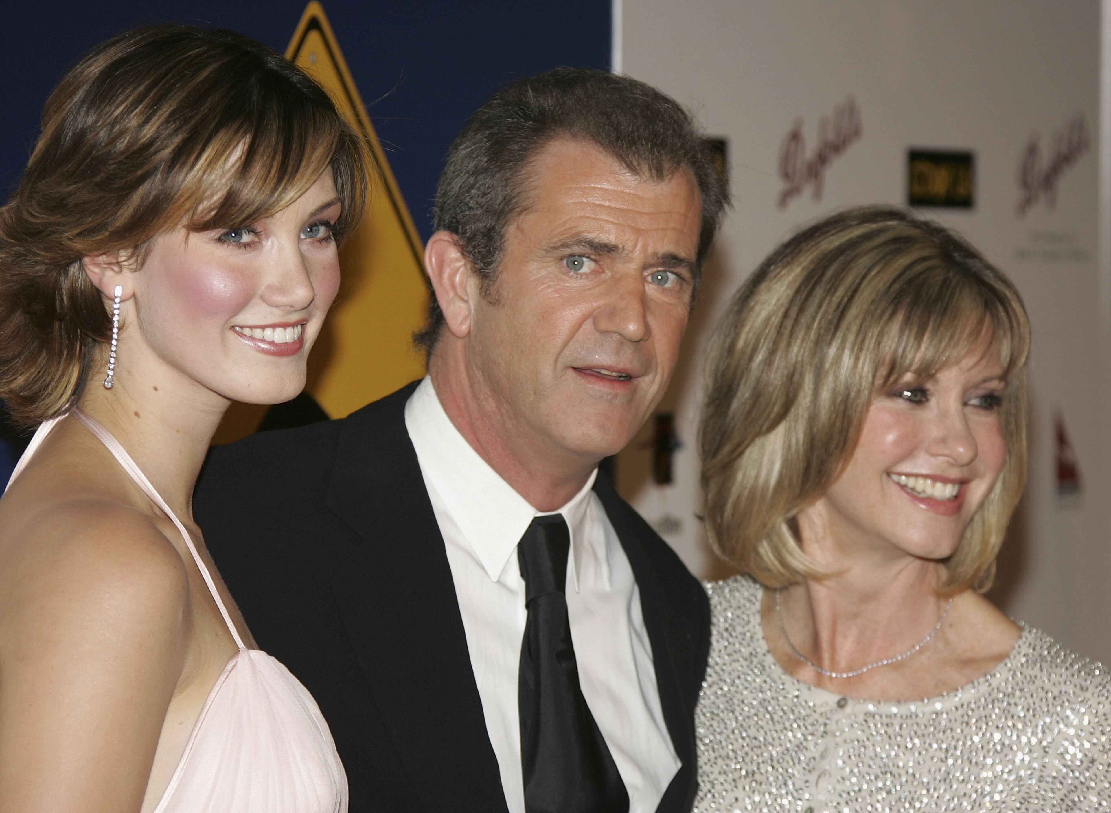 LOS ANGELES - JANUARY 15: (L-R): Singer Delta Goodrem, actor Mel Gibson and actress Olivia Newton John attend the Penfolds Gala Black Tie Dinner, the kick off event for G'Day LA: Australia Week 2005, at the Century Plaza Hotel on January 15, 2005 in Los Angeles, California. (Photo by Vince Bucci/Getty Images)