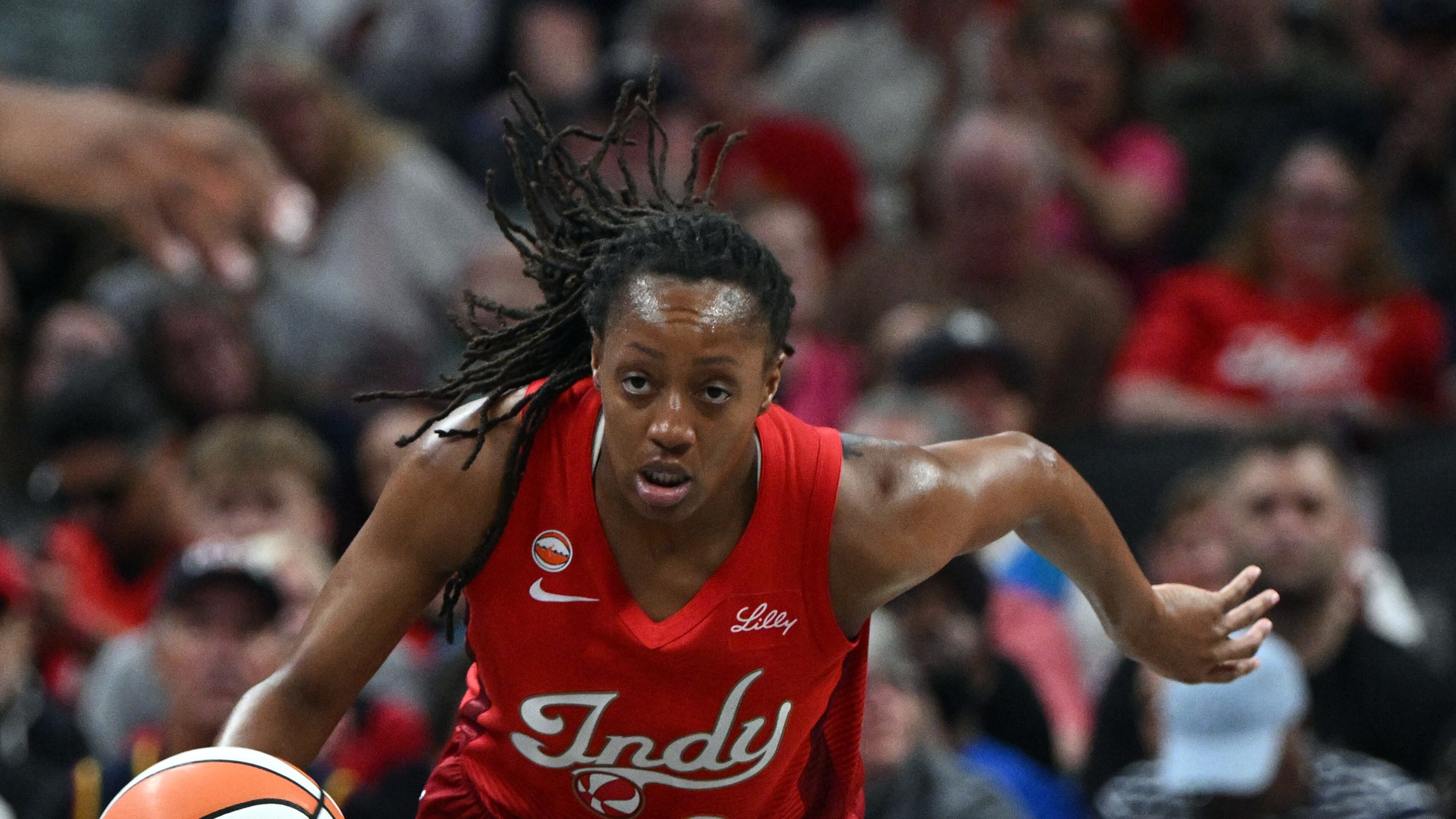 Indiana Fever guard Kelsey Mitchell (0) dribbles the ball down court during the first half of a WNBA basketball game against the Connecticut Sun, Friday, Aug. 28, 2026, in Indianapolis. (AP Photo/Marc Lebryk)