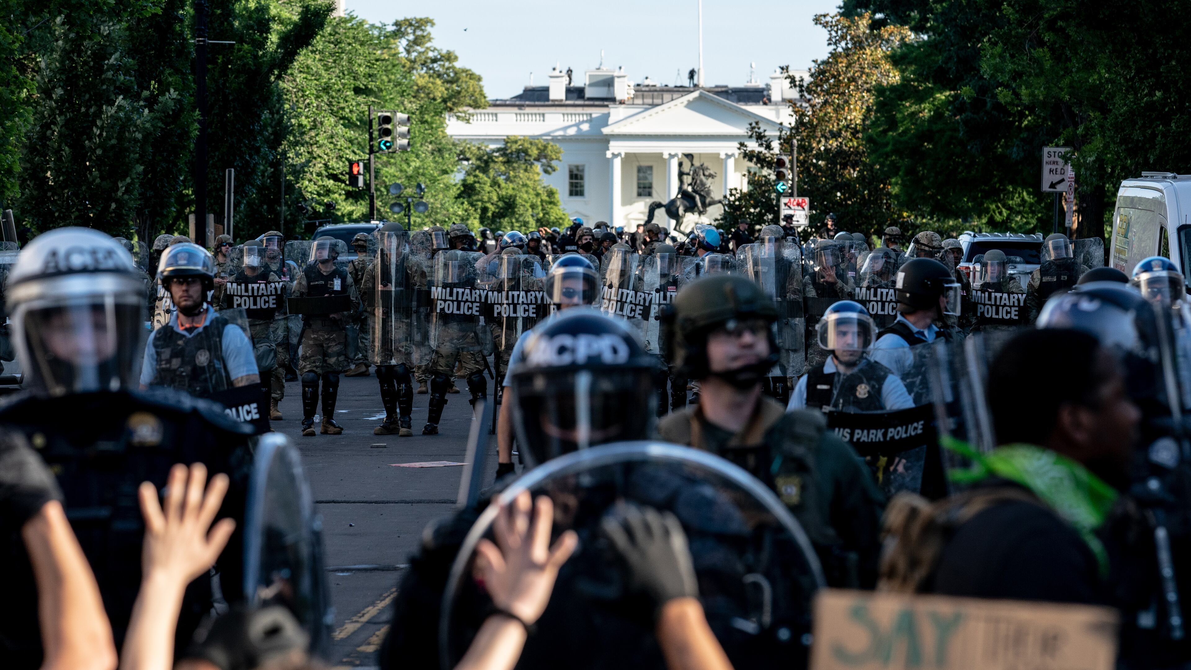 Police cleared a path for President Donald Trump through protesters near the White House in Washington on June 1, 2020. A federal watchdog said the U.S. Park Police had been planning to clear protesters from a park near the White House well before they learned that Trump was going to walk through the area last year. (Erin Schaff/The New York Times)