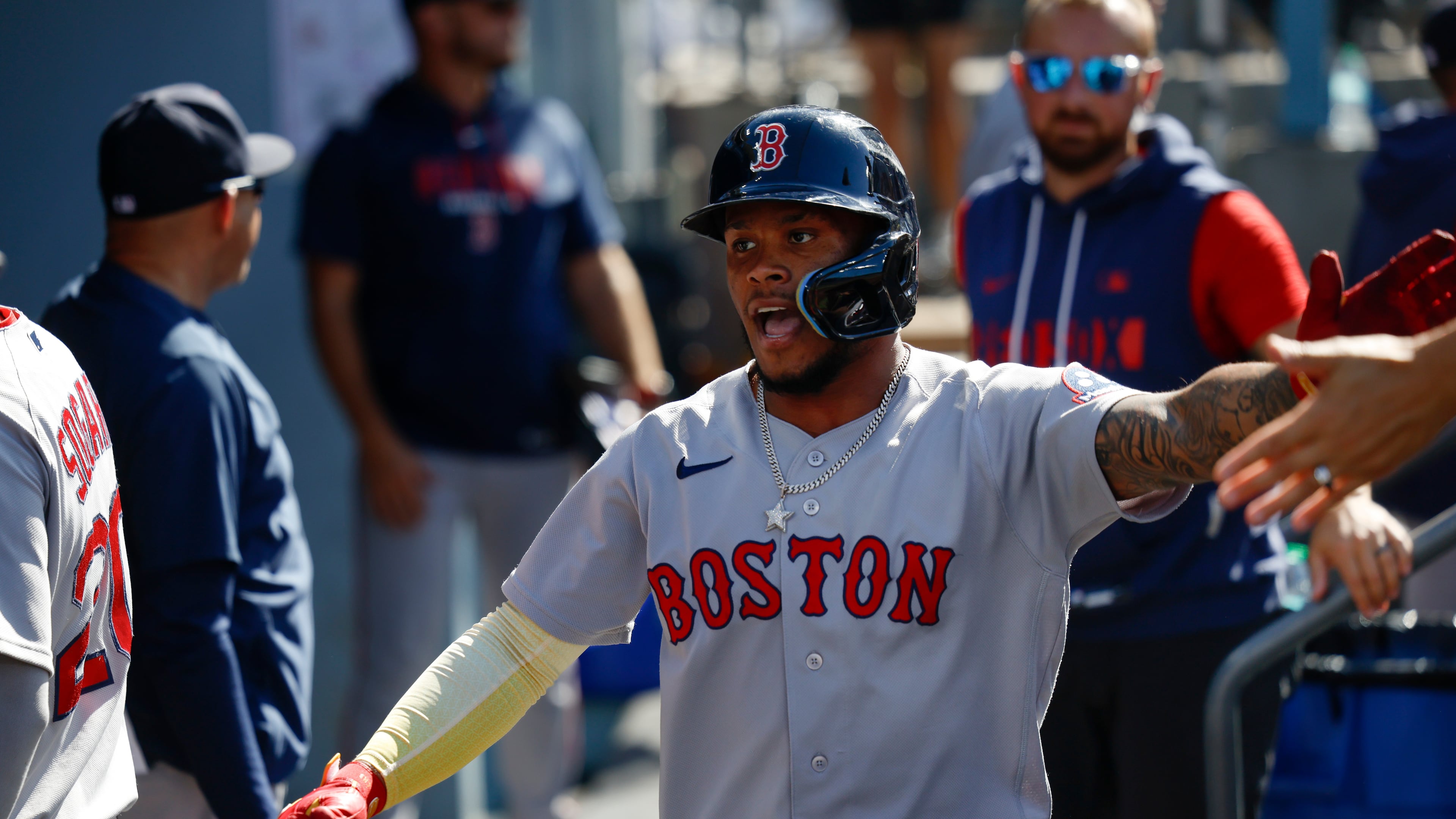 Boston Red Sox's Ceddanne Rafaela is greeted by teammates after scoring on a single hit by Sox's designated hitter Masataka Yoshida during the first inning of a baseball game, Sunday, Aug. 2, 2026, in Los Angeles. (AP Photo/Caroline Brehman)