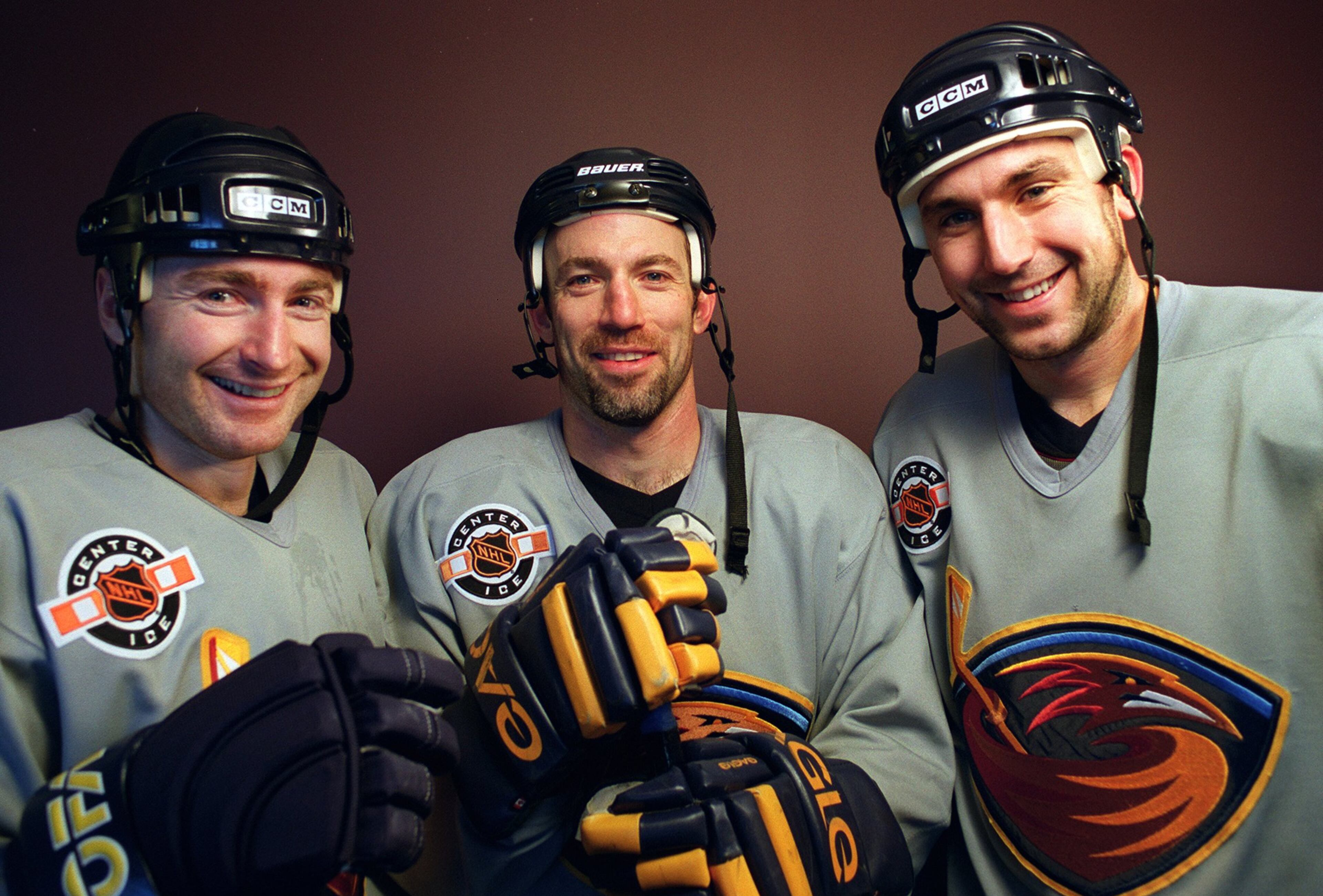 001218 DULUTH, GA: Atlanta Thrashers linemen (l-r) Donald Audette, Ray Ferraro & Andrew Brunette after practice Monday morning 12/18/00. (WILLIAM BERRY/staff) 12-18-00