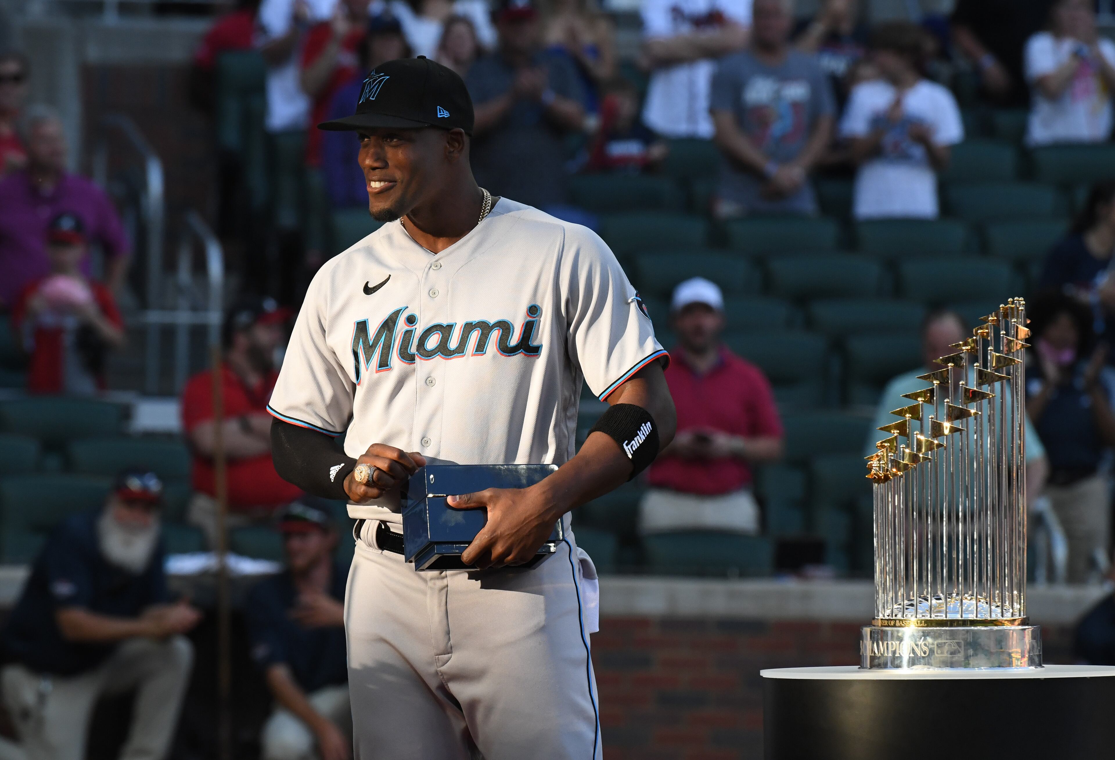 April 23, 2022 Atlanta - Former Braves’ Jorge Soler (12) receives his World Series Championship ring from Atlanta Braves' manager Brian Snitker (43) before Atlanta Braves home game against Miami Marlins at Truist Park on Saturday, April 23, 2022. (Hyosub Shin / Hyosub.Shin@ajc.com)