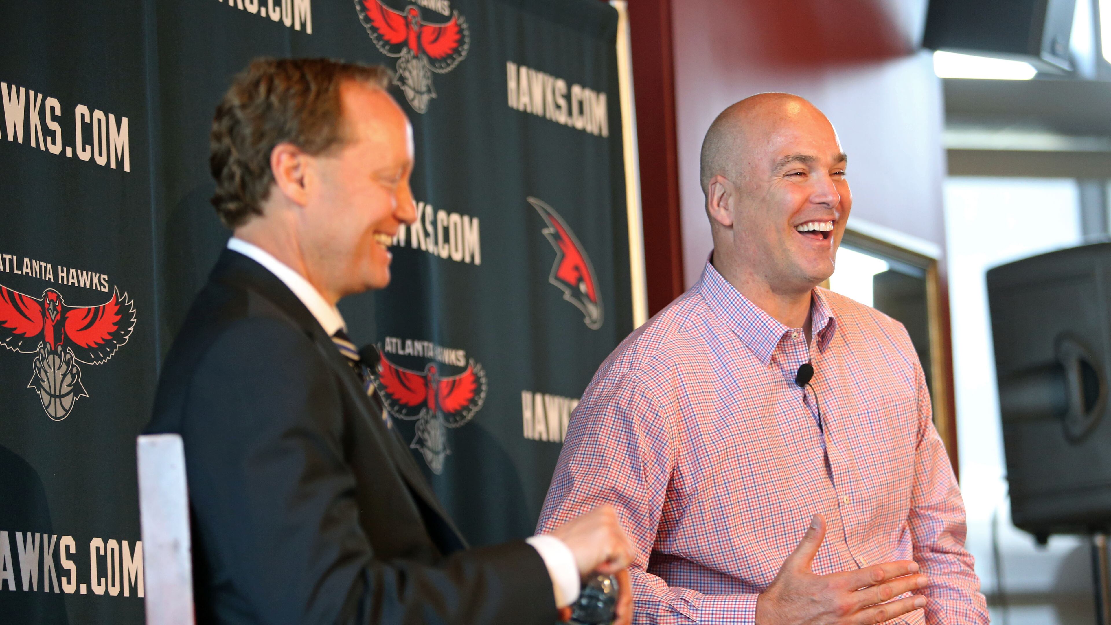Atlanta Hawks general manager Danny Ferry, right, and Atlanta Hawks new coach Mike Budenholzer react to a question from the media during Budenholzer's introductory news conference at Philips Arena Wednesday morning in Atlanta. JASON GETZ / JGETZ@AJC.COM
