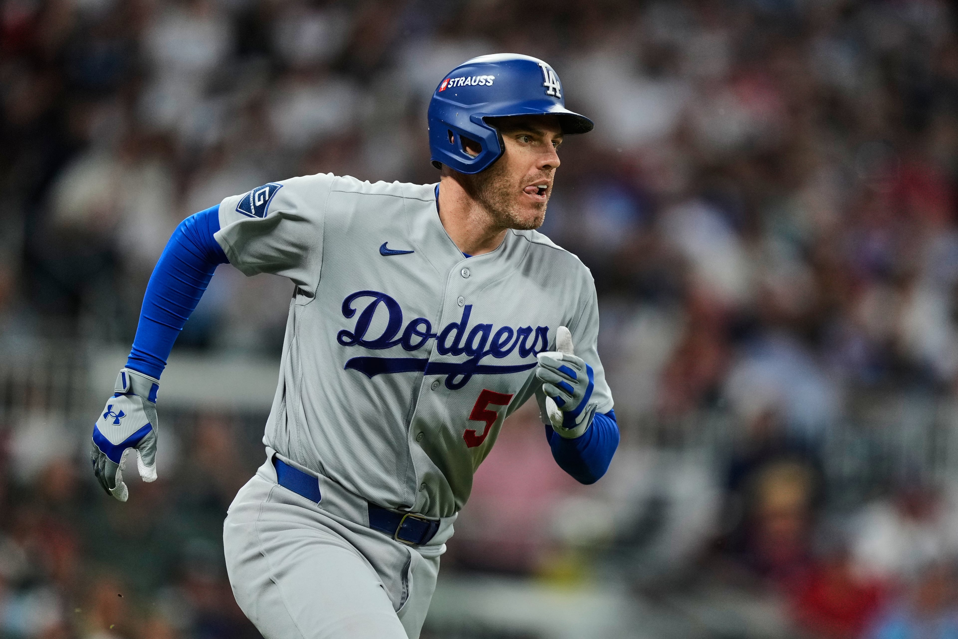Dodgers first baseman Freddie Freeman sprints around the bags after hitting a solo home run off the Braves during Game 3 of their National League Division Series on Tuesday. (Brynn Anderson/AP)
