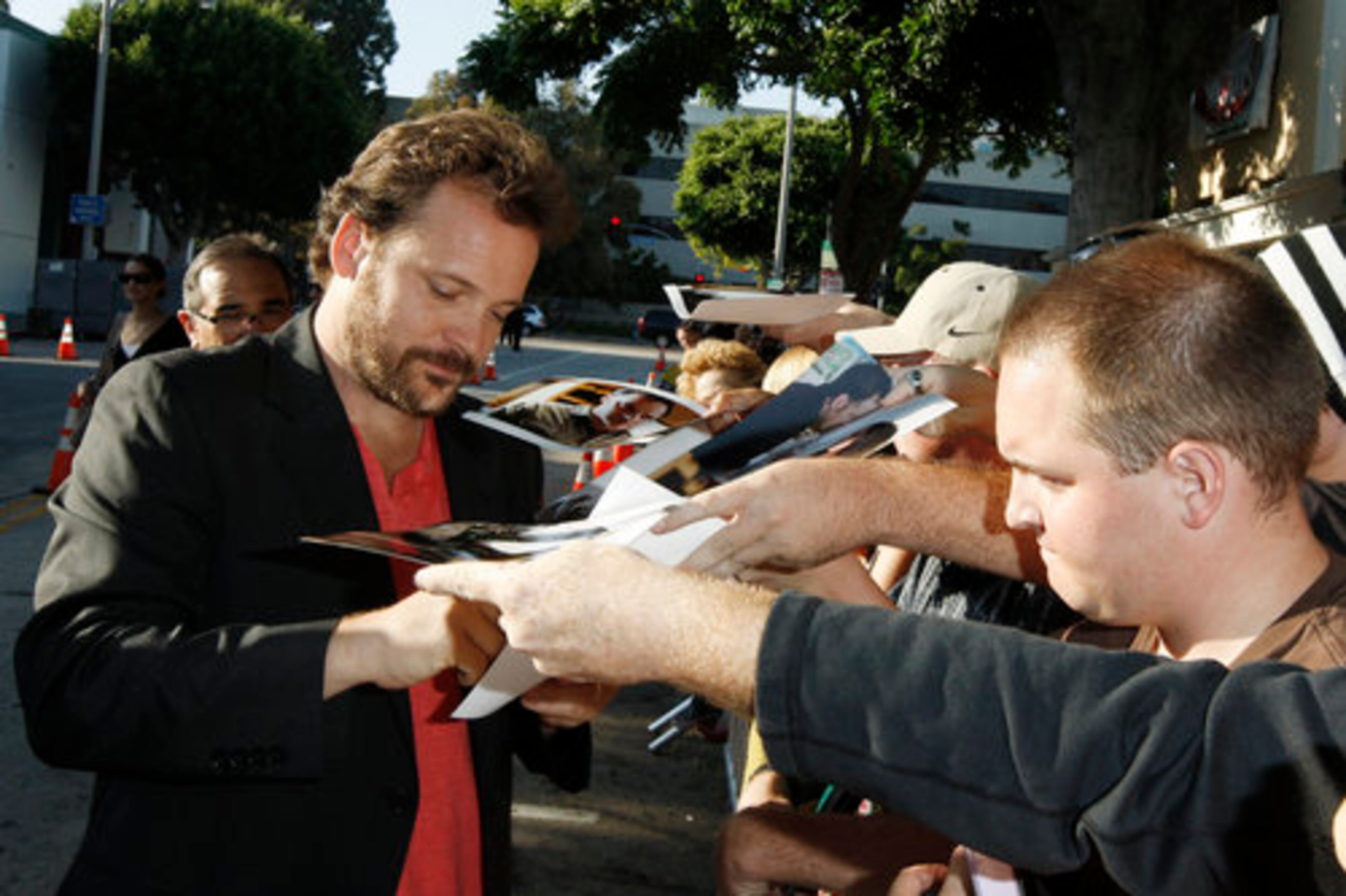Cast member Peter Sarsgaard signs autographs. In "Orphan", in the aftermath of a miscarriage, prospective parents Kate (Farmiga) and John (Sarsgaard) find their lives turned upside down. They visit an orphanage to adopt.