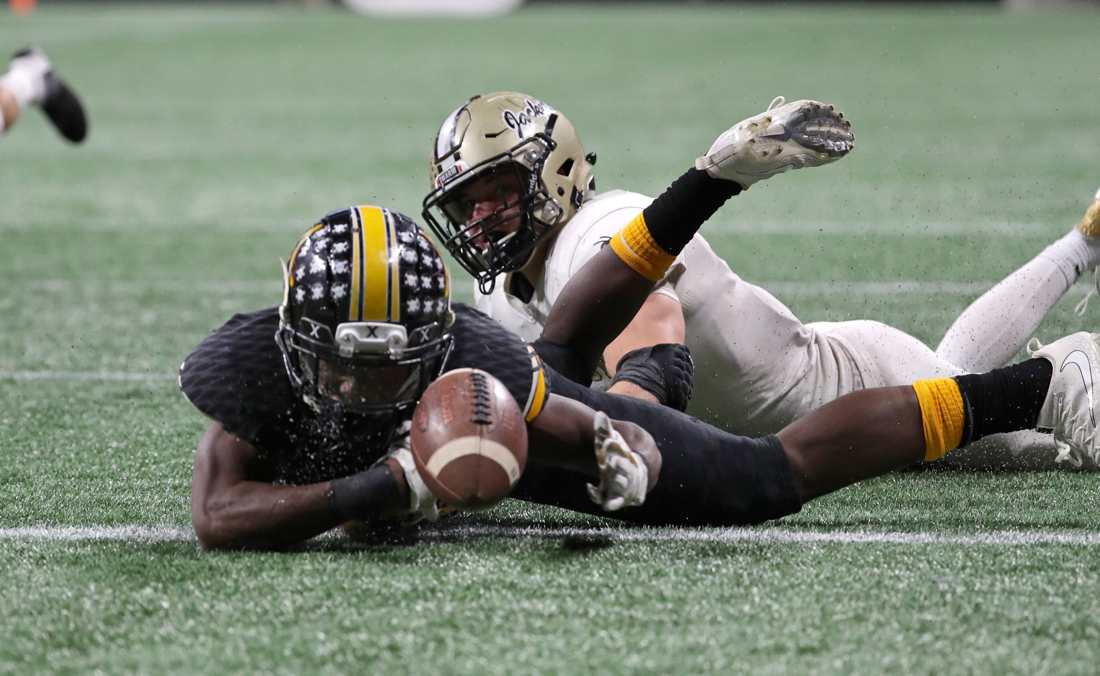 Peach County wide receiver Noah Whittington appears to lose possession after landing while stretching for the end zone. PHOTO / JASON GETZ
