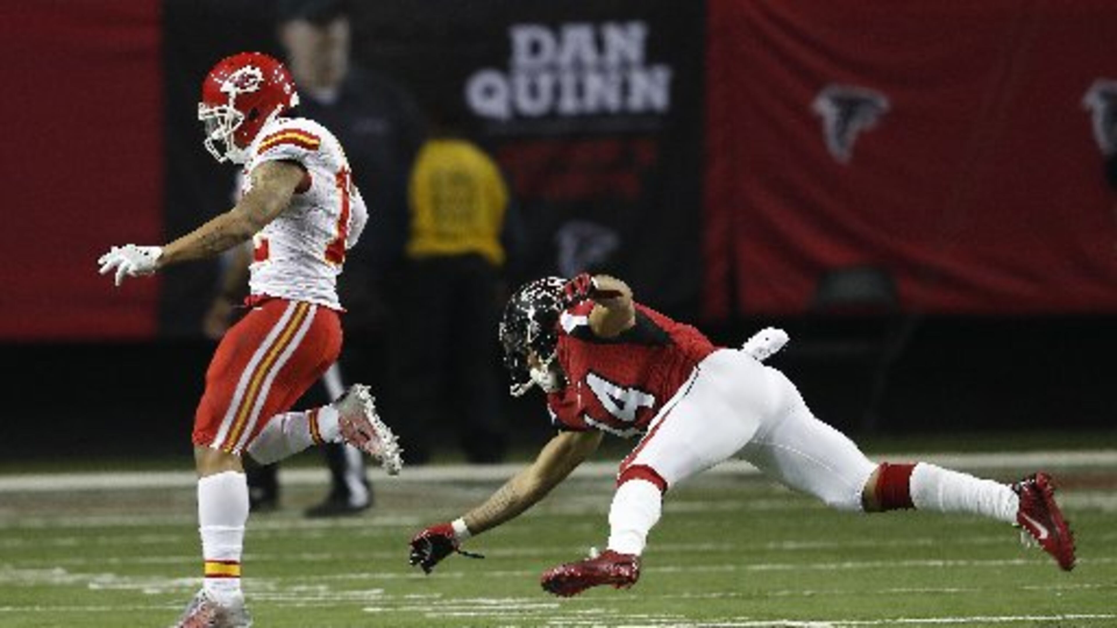 Albert Wilson gets away from Eric Weems during his 55-yard touchdown run on a fake punt. (AP Photo)
