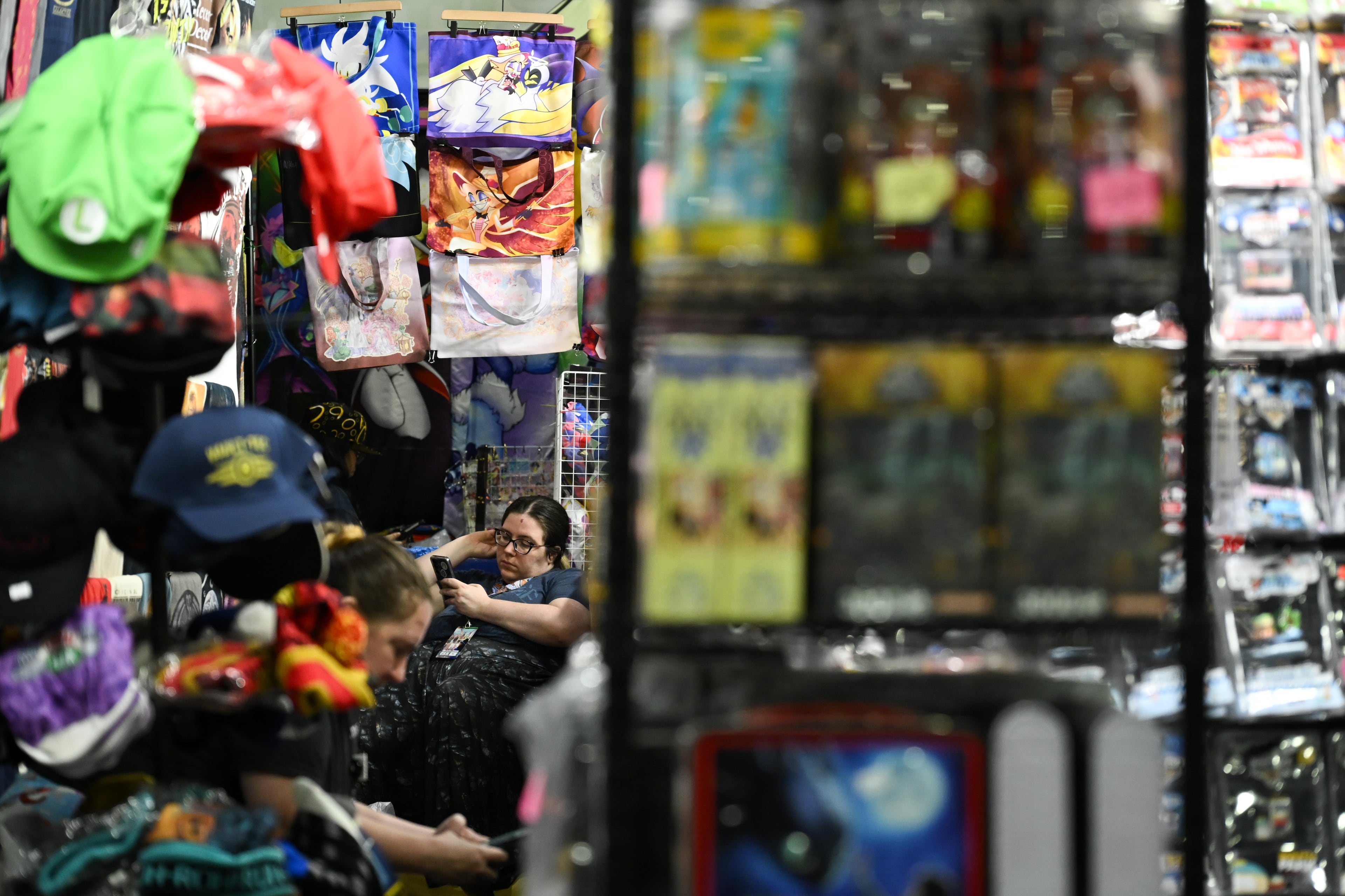 Vendors wait for customers to arrive during MomoCon at the Georgia World Congress Center in Atlanta on Friday, May 22, 2026. (Tyler Sun for the AJC)