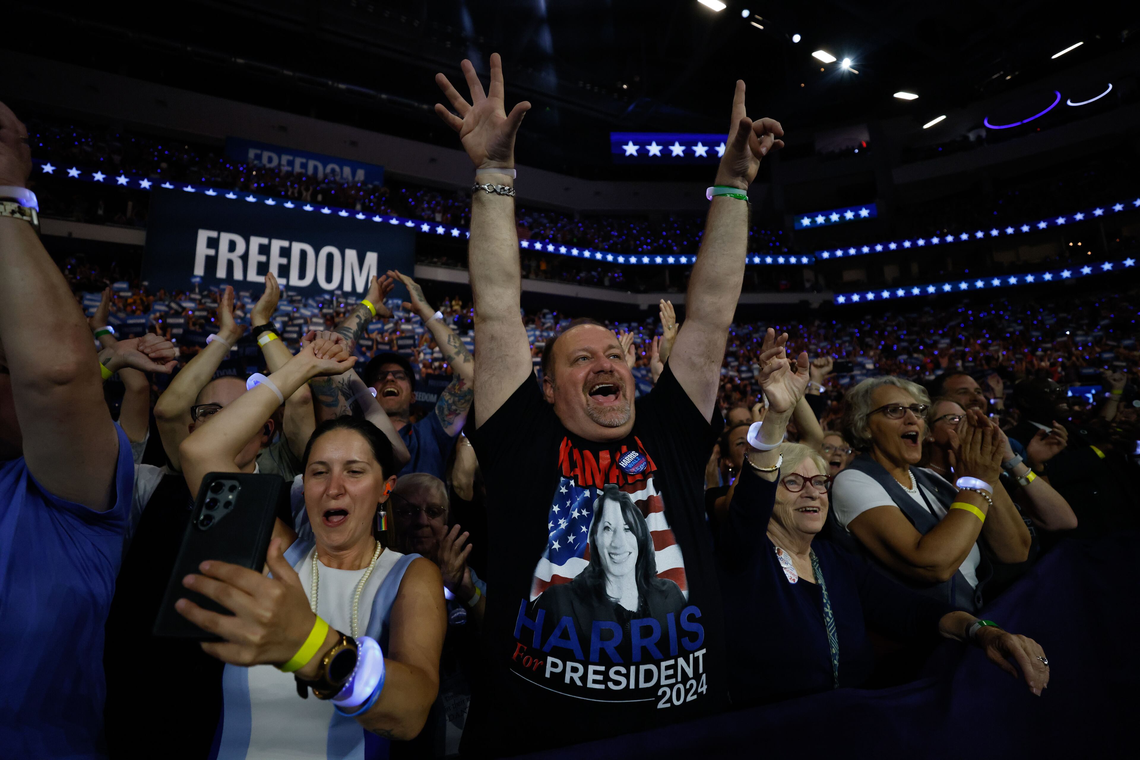 Supporters of Vice President Kamala Harris and her running mate Tim Walz cheer during a campaign rally on Tuesday, August 2024, at the Fiserv Forum in Milwaukee.
(Miguel Martinez / AJC)
