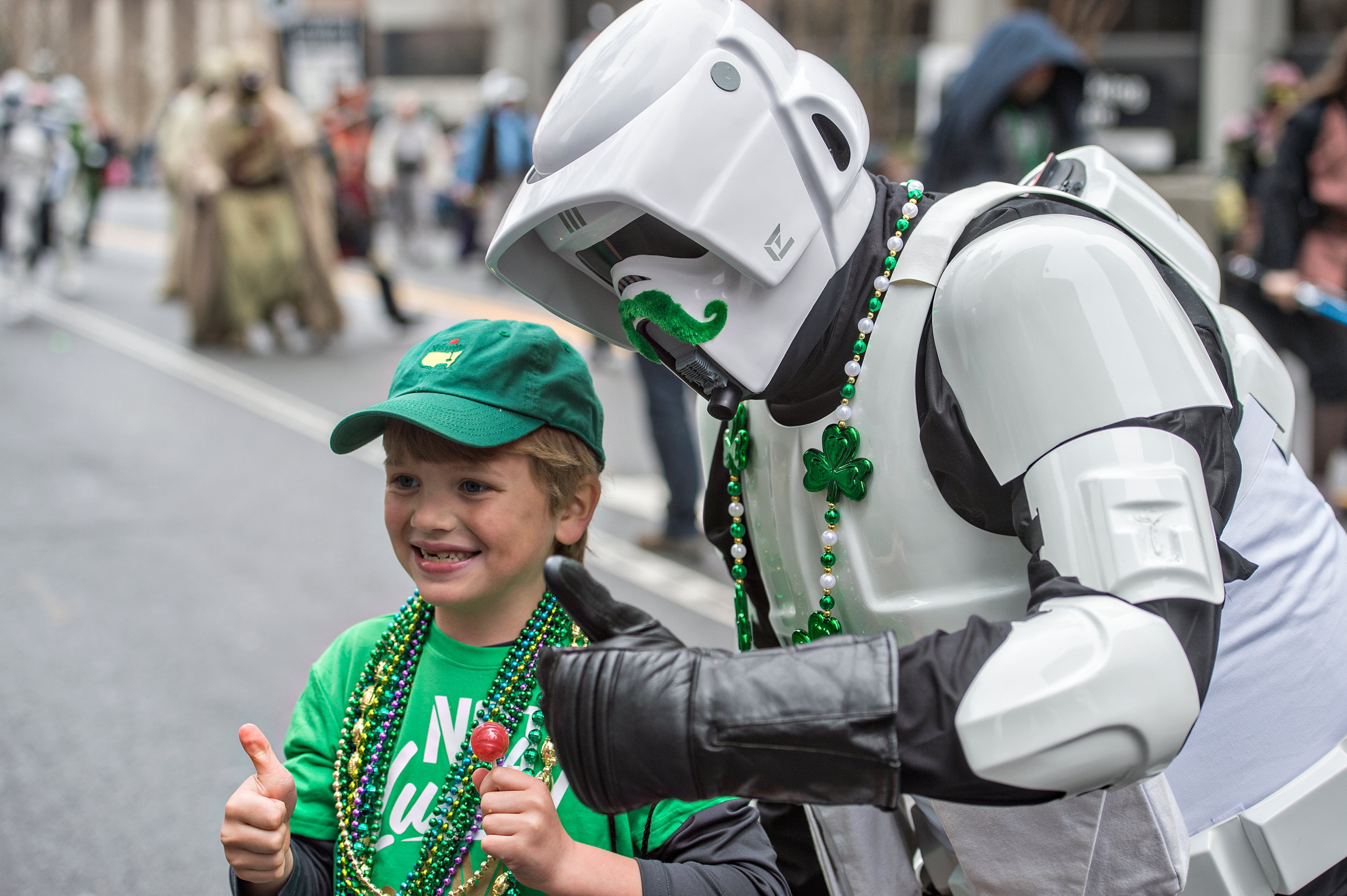Dressed as a scout trooper from Star Wars, Shane Duncan (right) poses for a photo with Tate Adams during the 2015 Atlanta St. Patrick's Parade on March 14, 2015.