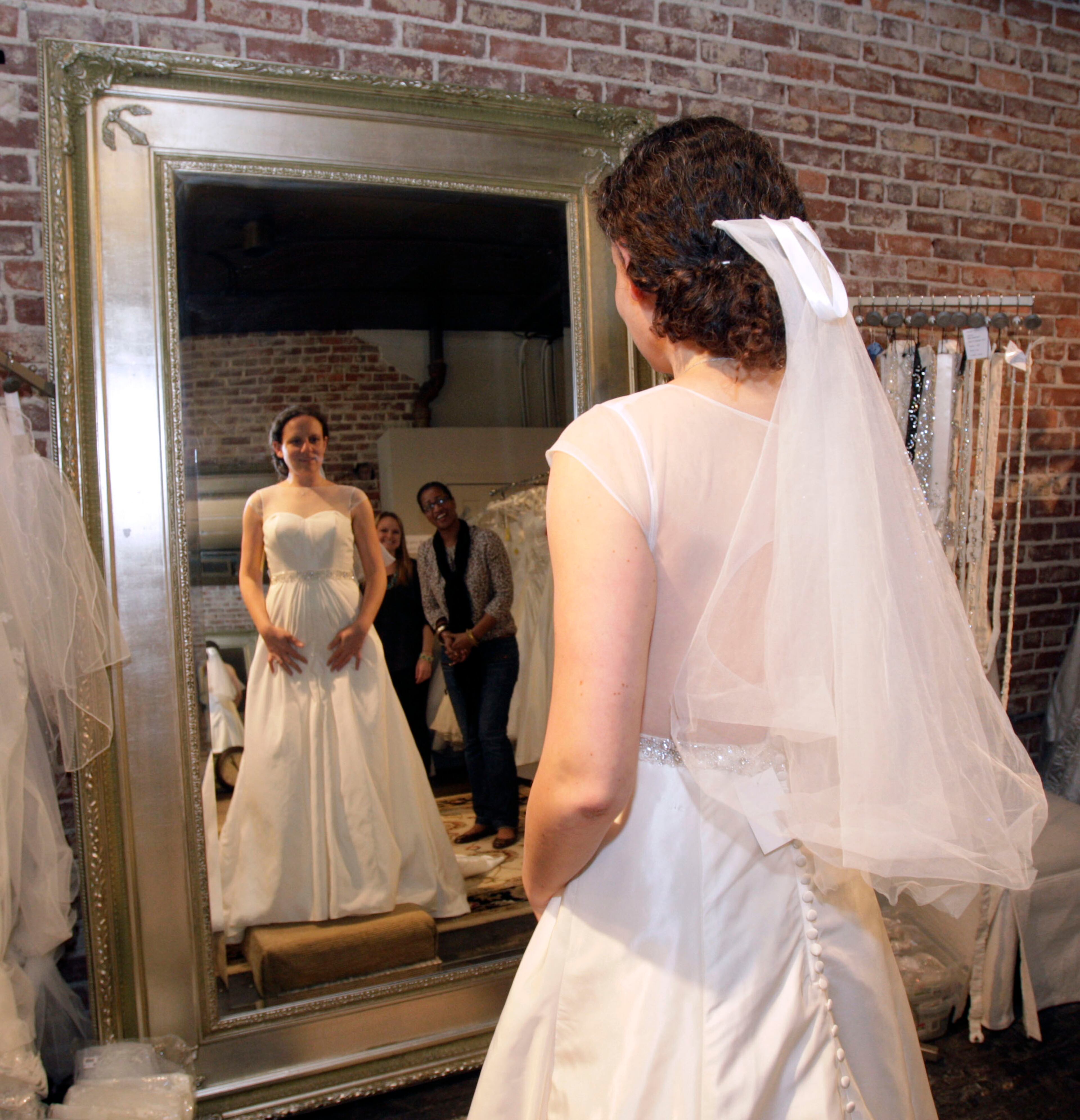 This taffeta gown with illusion neckline, keyhole back and beaded belt, comes in at an affordable $599.