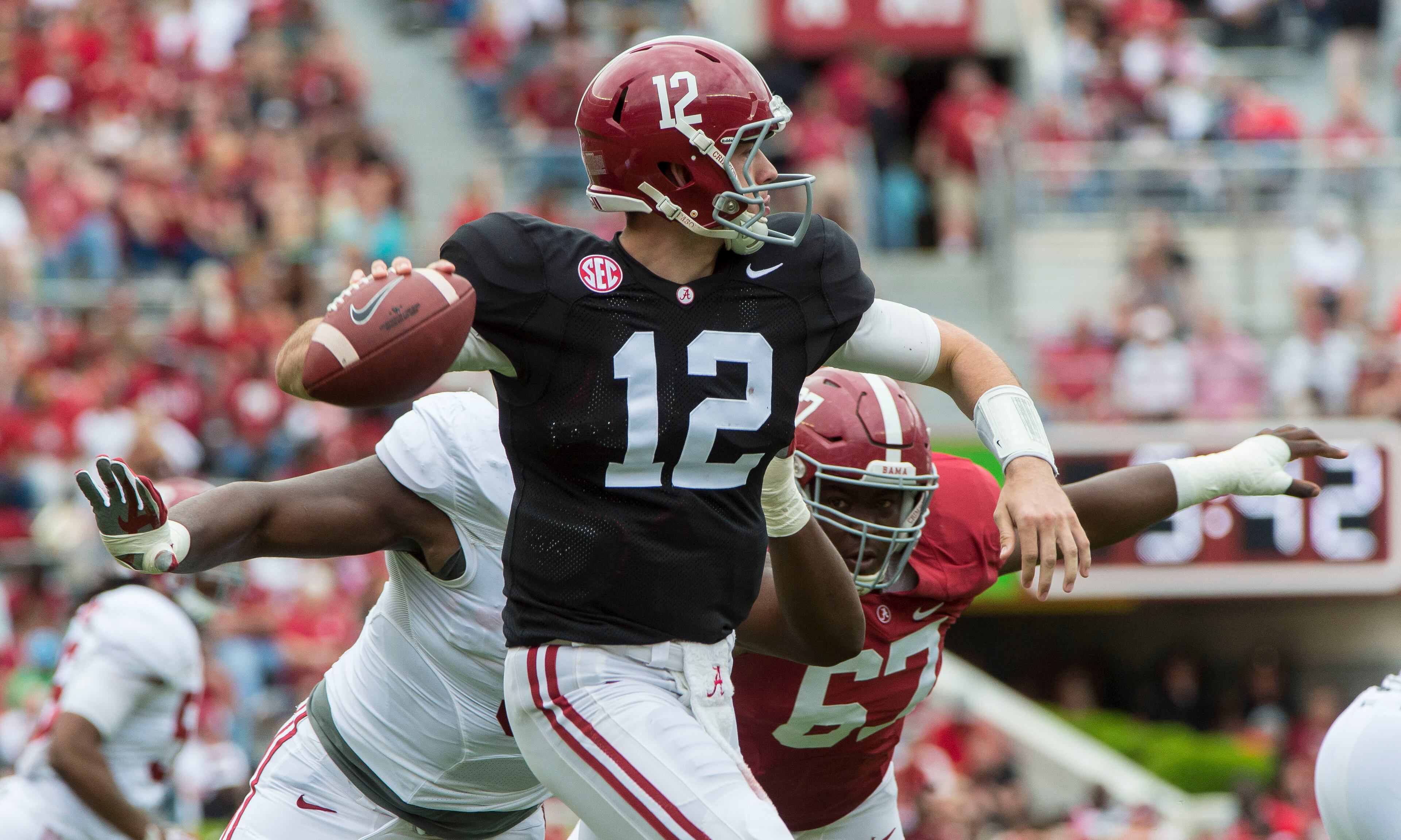 Alabama quarterback David Cornwell (12) rolls out under pressure during the second half of the NCAA college football team's A-Day spring game, Saturday, April 16, 2016, in Tuscaloosa, Ala. (Vasha Hunt/AL.com via AP)