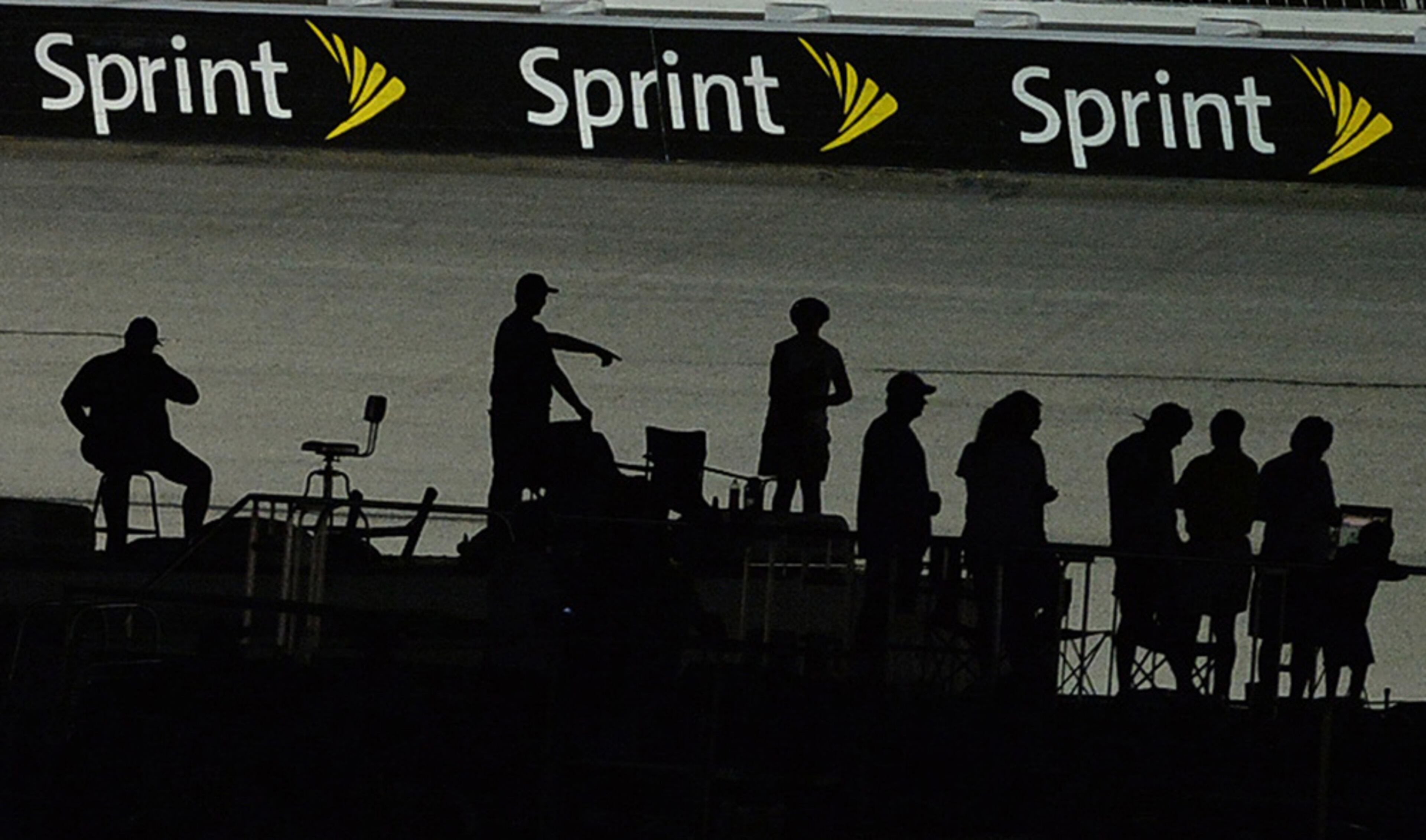 September 1, 2013 - Hampton: My best silhouettes photo of 2013. NASCAR fans appear as silhouettes on the back stretch during the Advocare 500 at Atlanta Motor Speedway on Sunday, September 1, 2013. Camera Nikon D4, Lens 500 f4, ISO 3200, Aperture f4, Shutter speed 1/1000. JOHNNY CRAWFORD / JCRAWFORD@AJC.COM