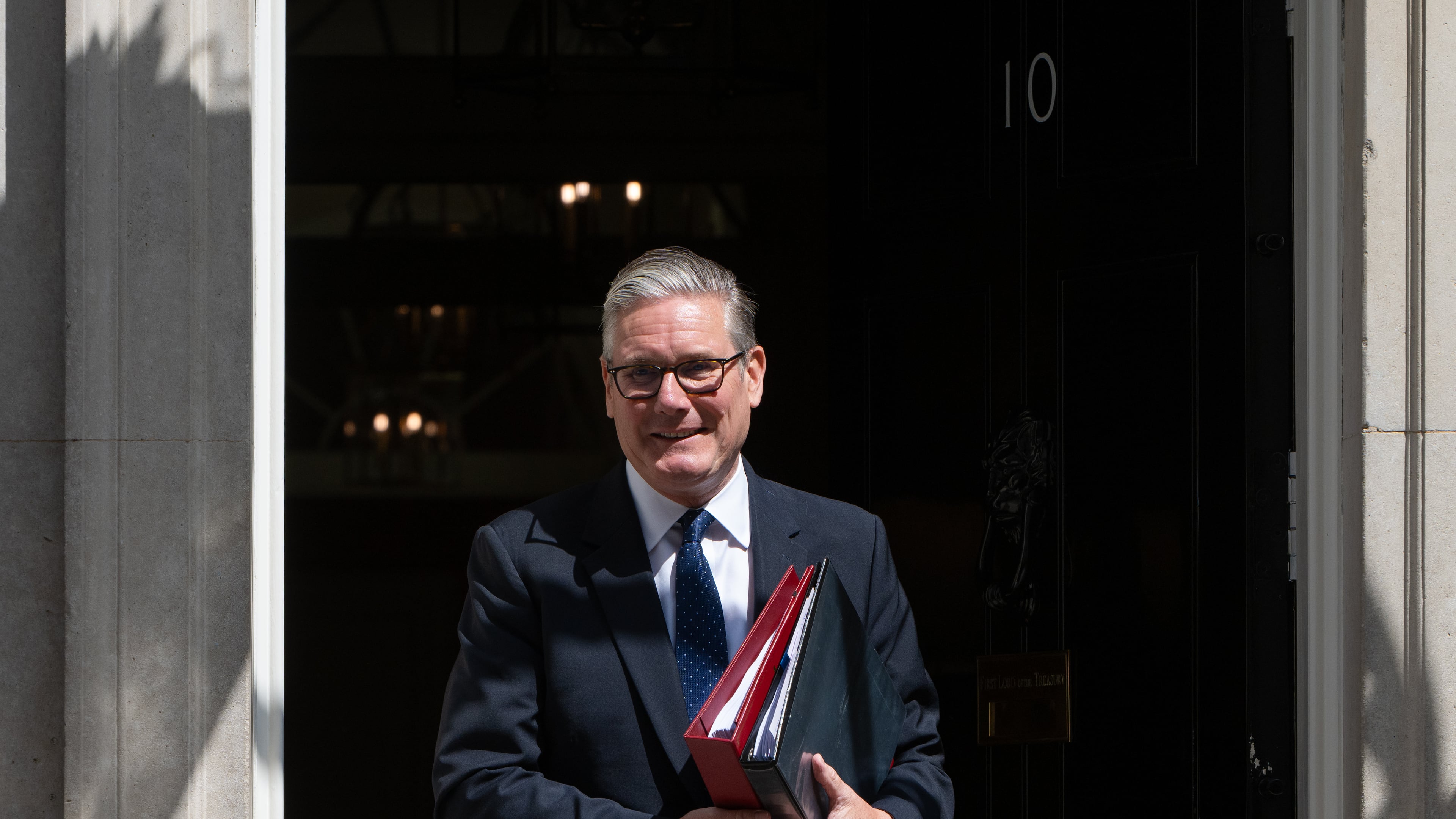 Britain's Prime Minister Keir Starmer leaves 10 Downing Street to attend Prime Minister's Questions at the House of Commons in London, Wednesday, July 15, 2026. (AP Photo/Thomas Krych)