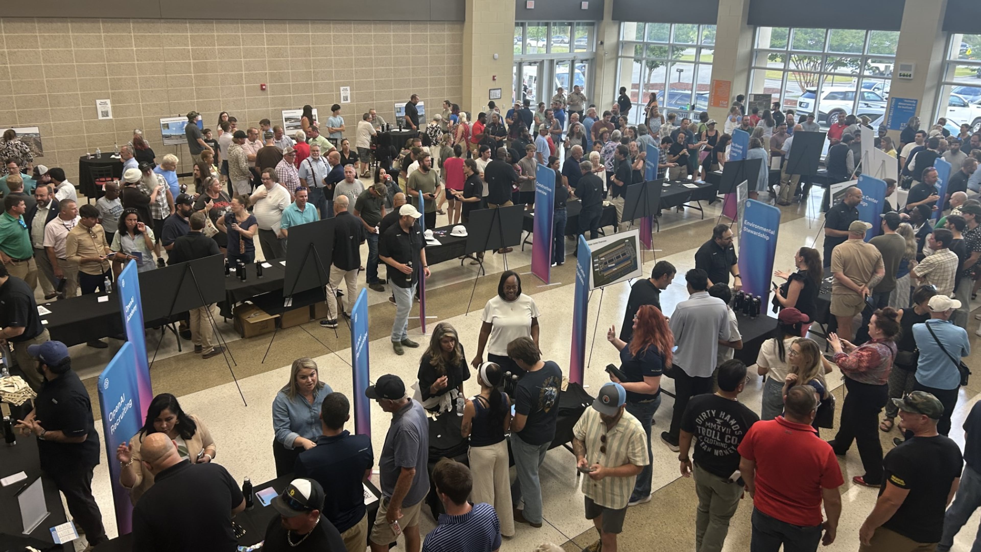 Savannah-area residents packed the Effingham College and Career Academy atrium Thursday, July 23, 2026, for the OpenAI data center open house. (Adam Van Brimmer/AJC)