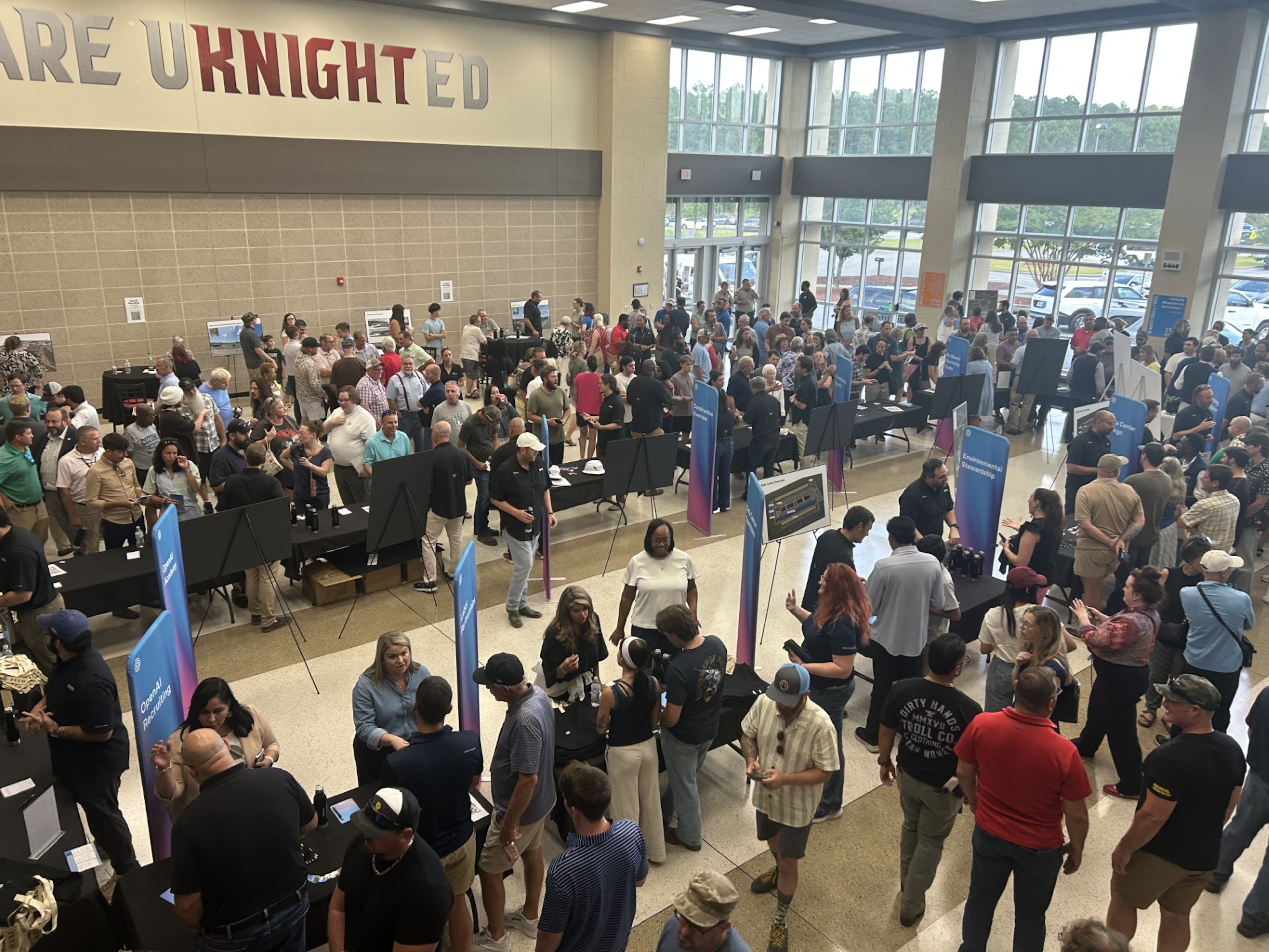 Savannah-area residents packed the Effingham College and Career Academy atrium for an OpenAI data center open house. Spoiler: They weren't fans. (Adam Van Brimmer/AJC)