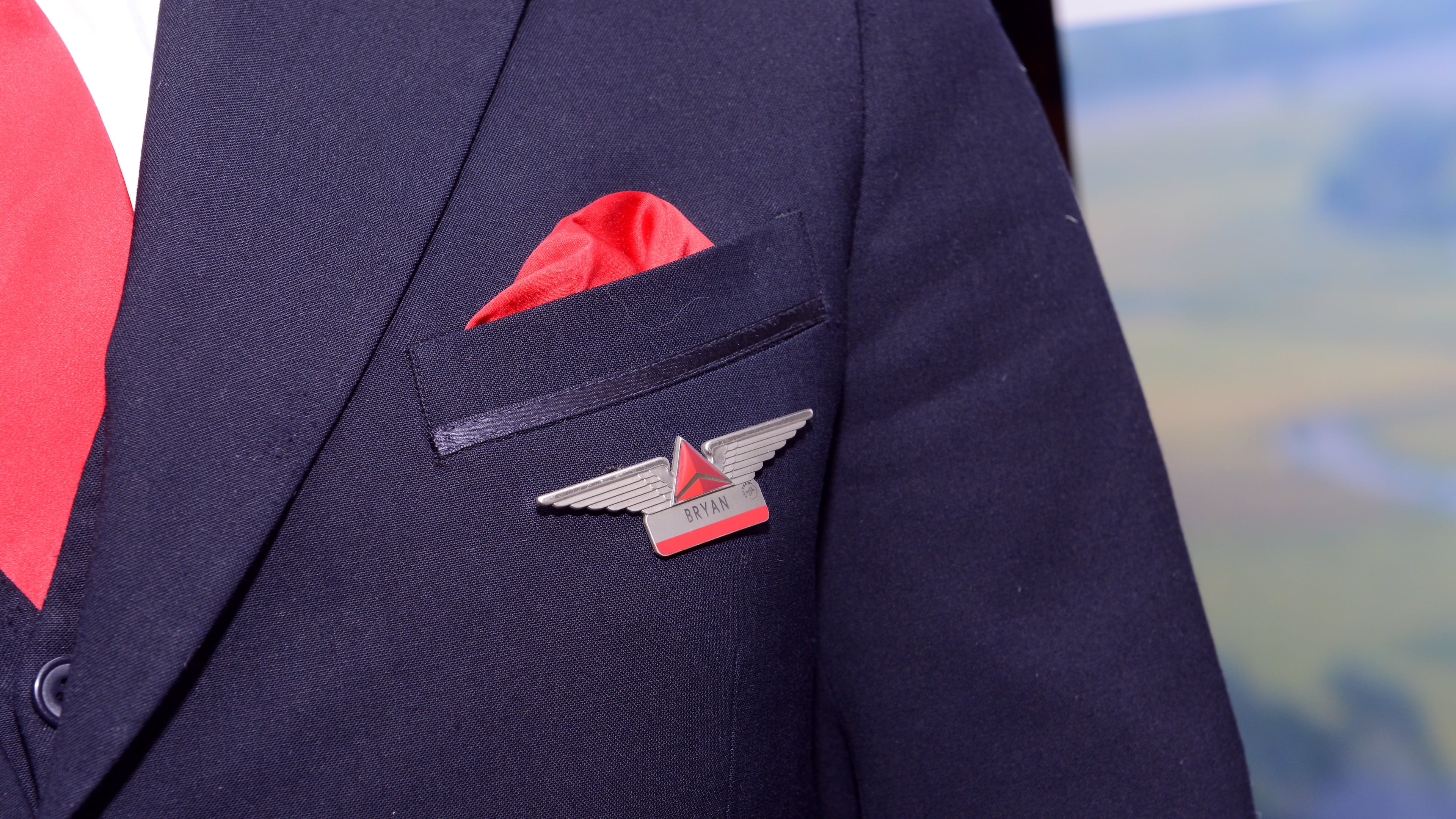 NEW YORK, NY - OCTOBER 17: A Delta employee displays a pin on his uniform. (Photo by Noam Galai/Getty Images for NYCWFF)