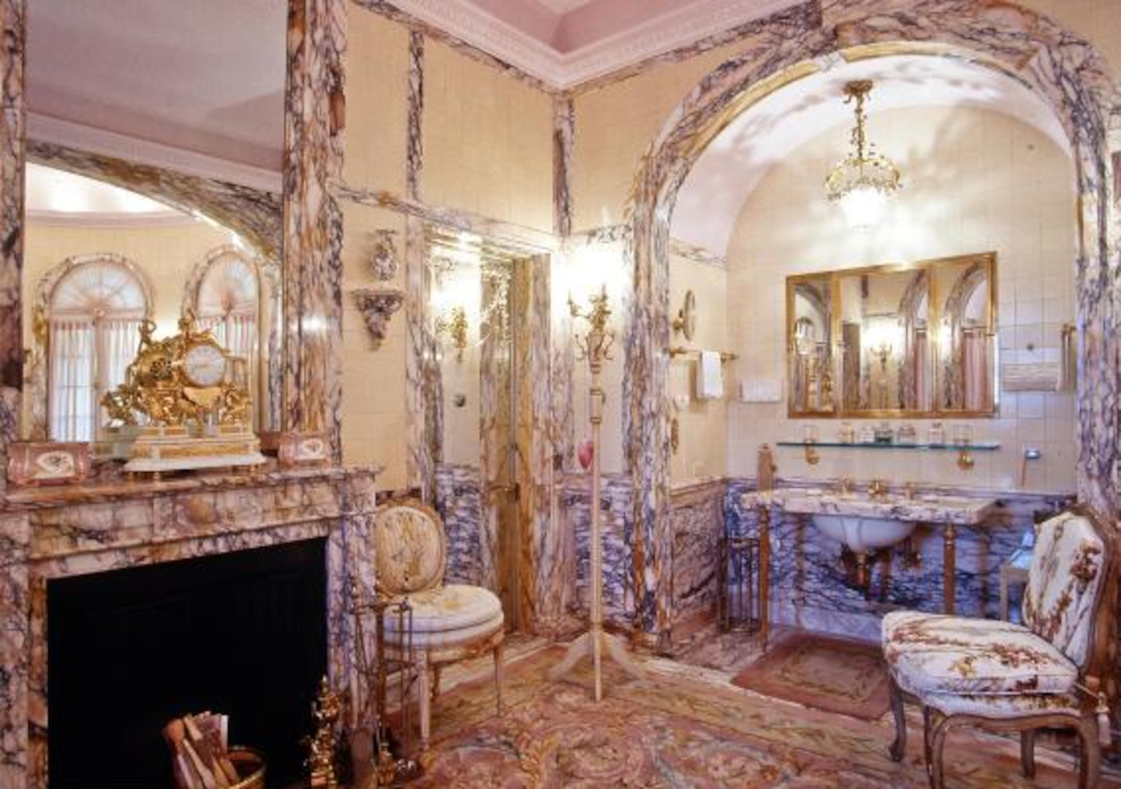 Rare pink and gold marble adds femininity to Marjorie's dressing room, which served as her office and exercise room.